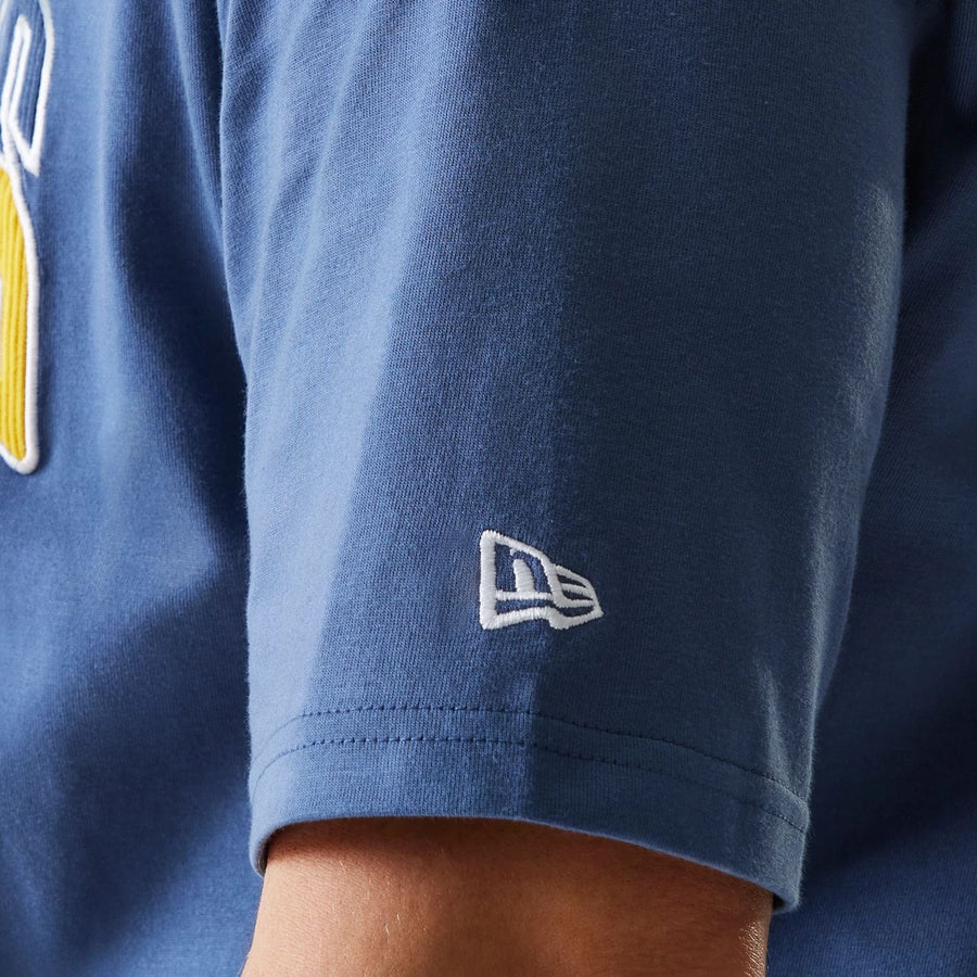 The Male model is wearing LA Lakers NBA Arch Graphic Dark Blue Oversized T-Shirt 7