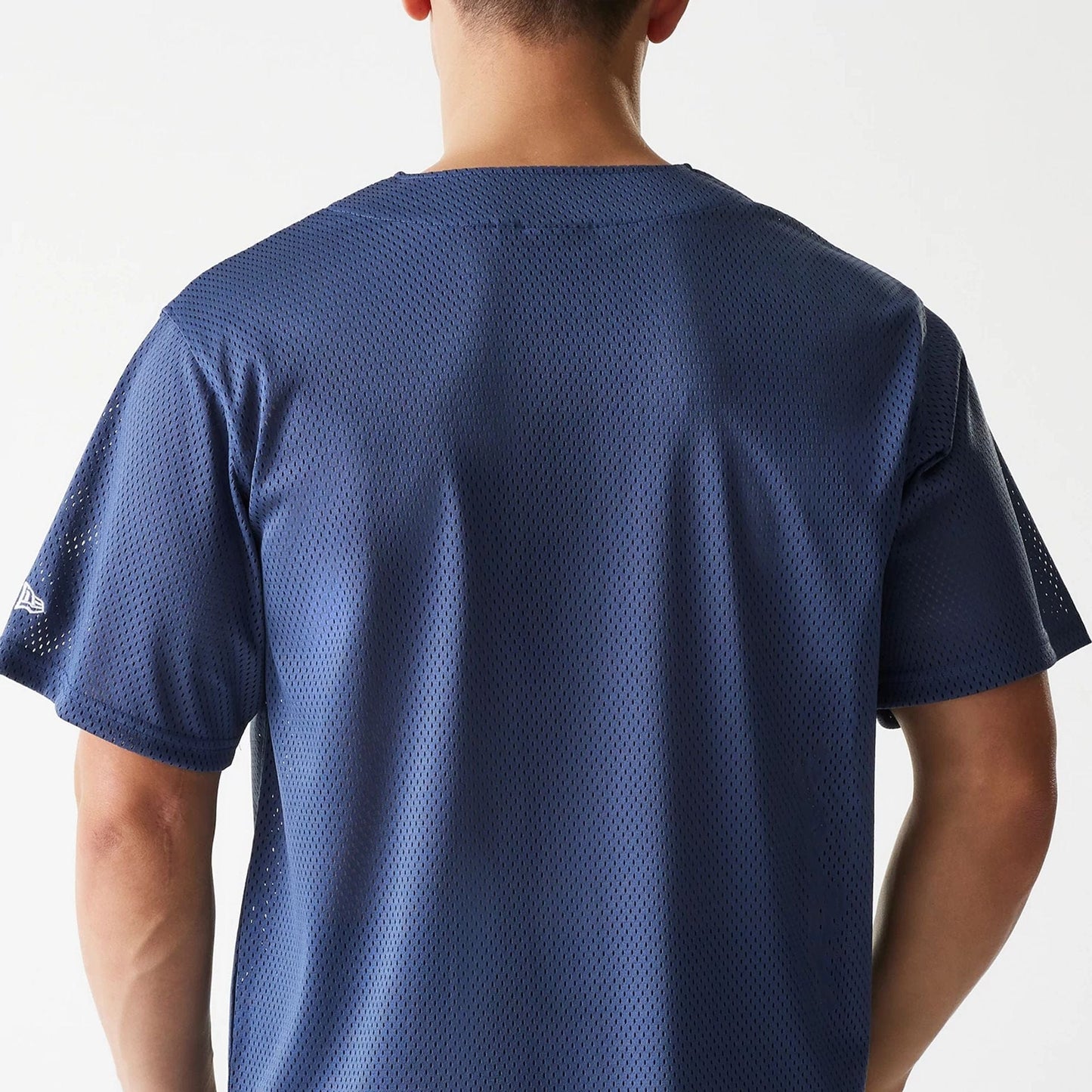 The Male model is wearing LA Lakers NBA Arch Graphic Dark Blue Mesh Jersey 5