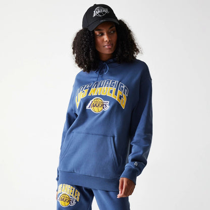 The Male model is wearing LA Lakers NBA Arch Graphic Dark Blue Oversized Pullover Hoodie 4