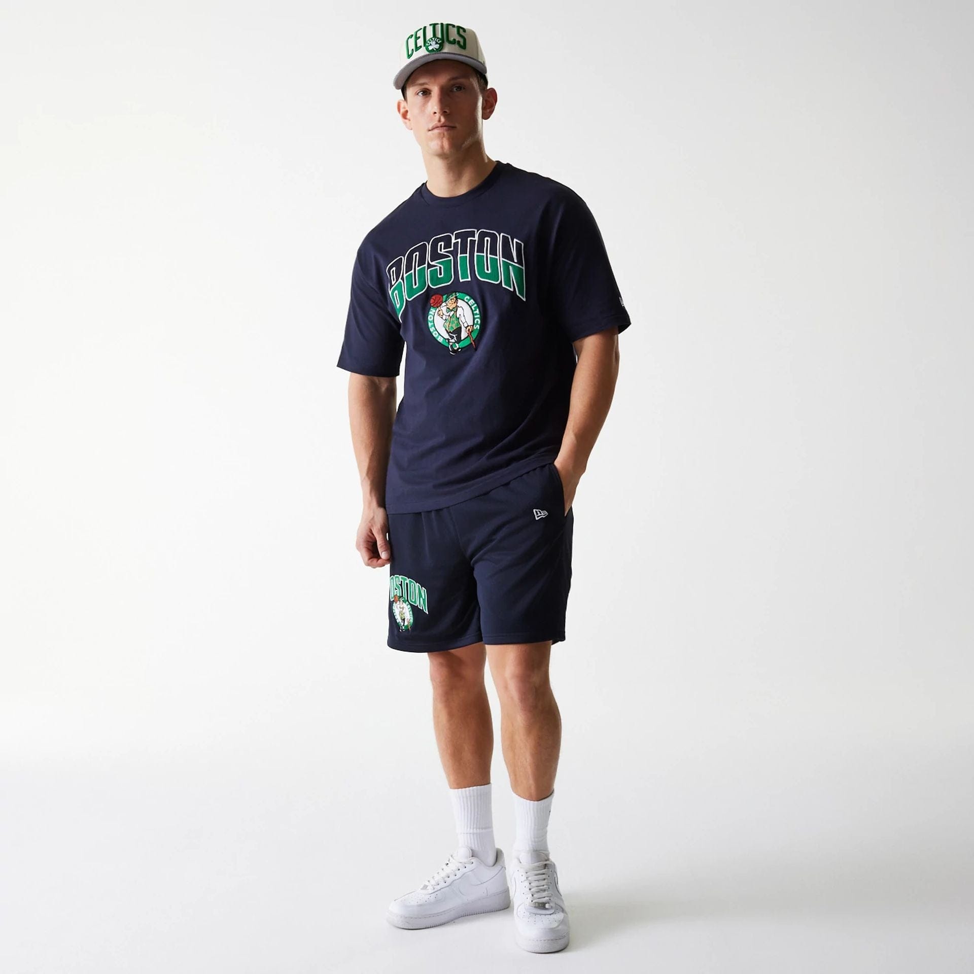 The Male model is wearing Boston Celtics NBA Arch Graphic Navy Mesh Shorts 8
