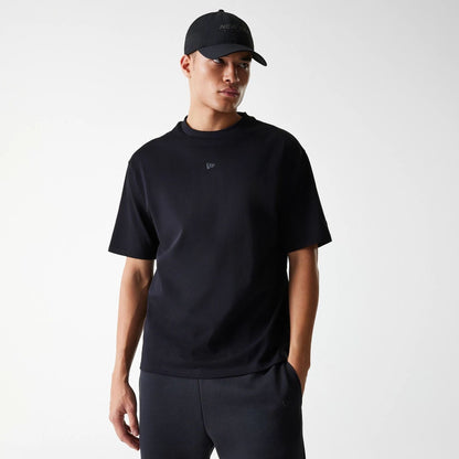 The Male model is wearing New Era Tech Black Oversized T-Shirt 1