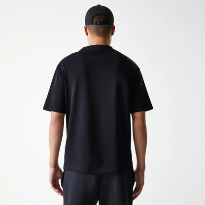 The Male model is wearing New Era Tech Black Oversized T-Shirt 2