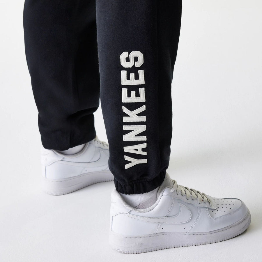 The Male model is wearing New York Yankees MLB Heritage Black Joggers 3