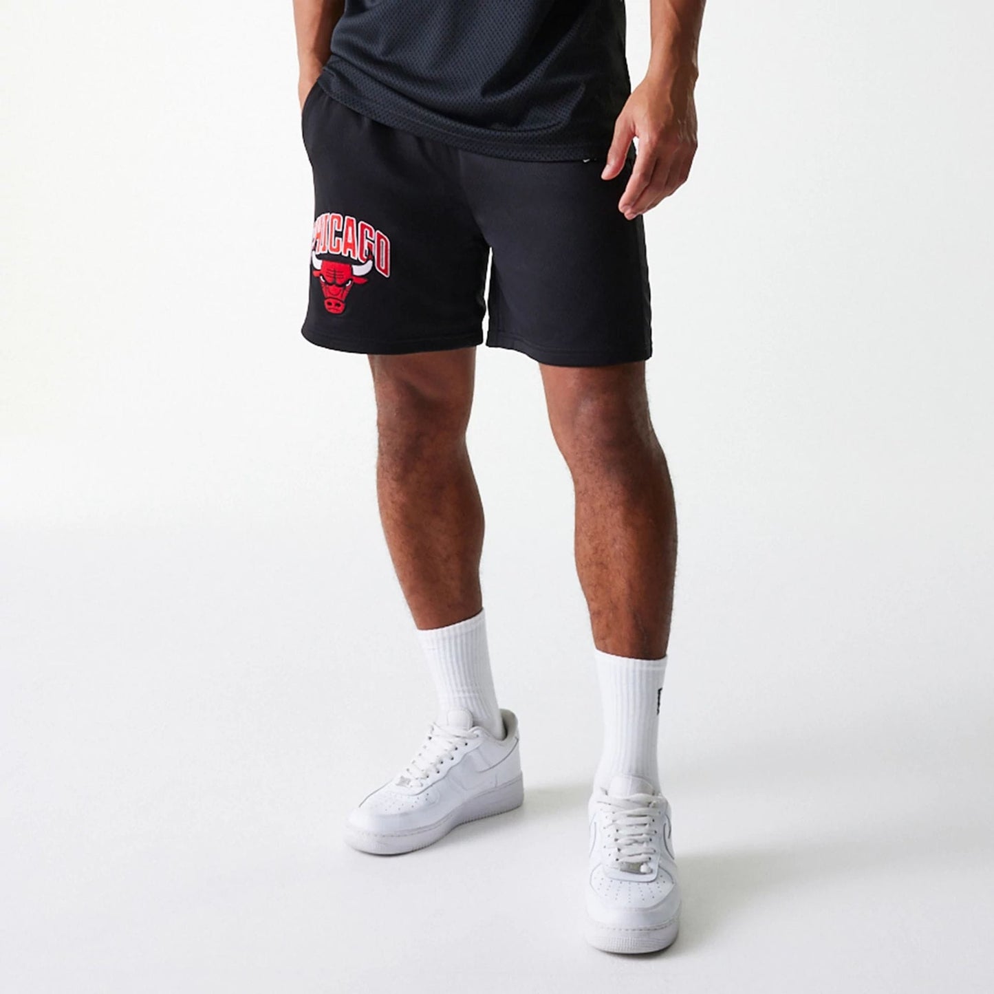 The Male model is wearing Chicago Bulls NBA Arch Graphic Black Mesh Shorts 7