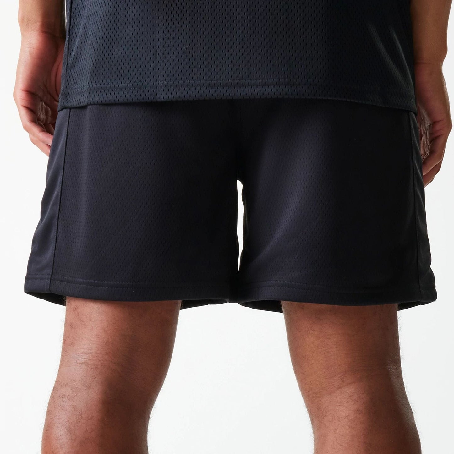 The Male model is wearing Chicago Bulls NBA Arch Graphic Black Mesh Shorts 6