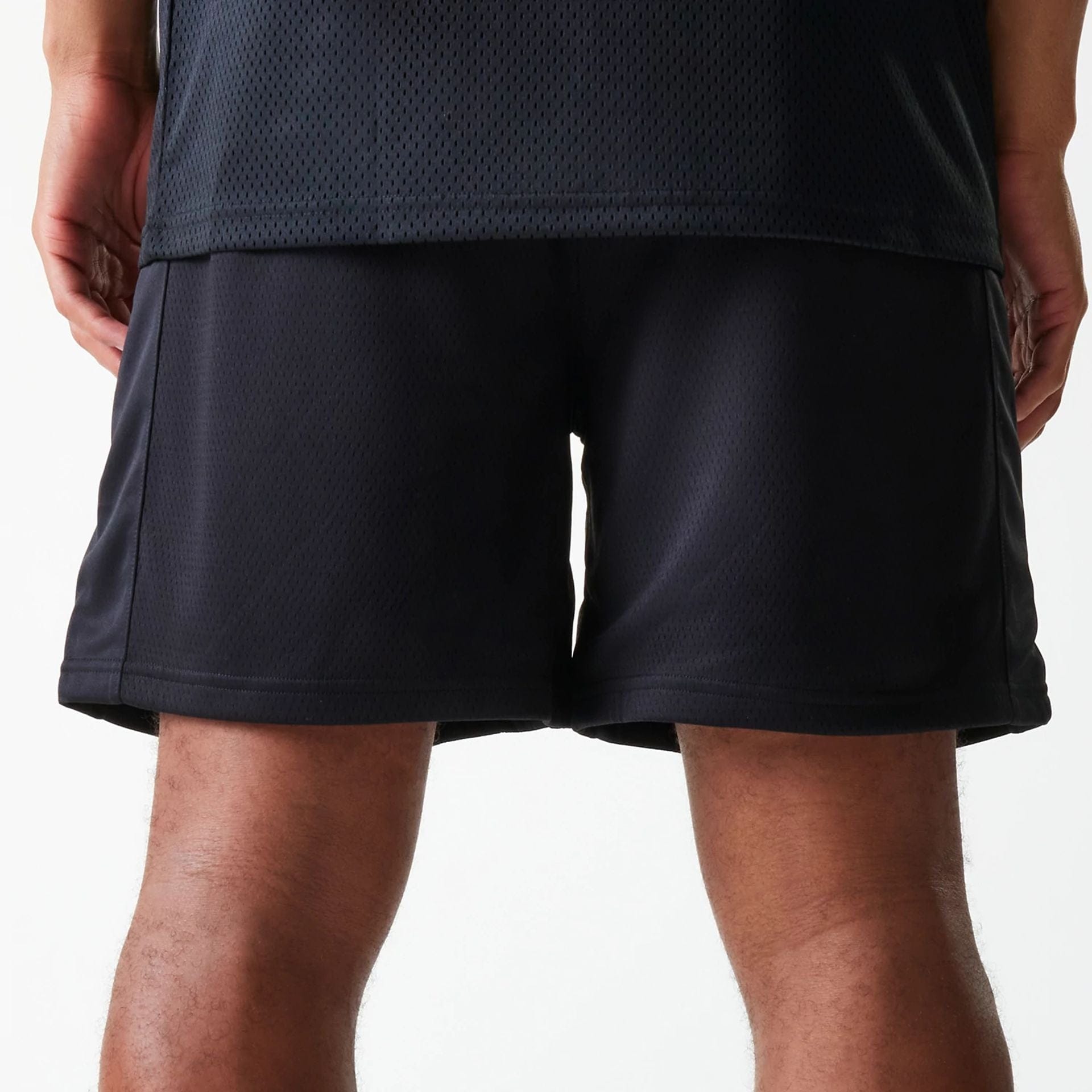 The Male model is wearing Chicago Bulls NBA Arch Graphic Black Mesh Shorts 6