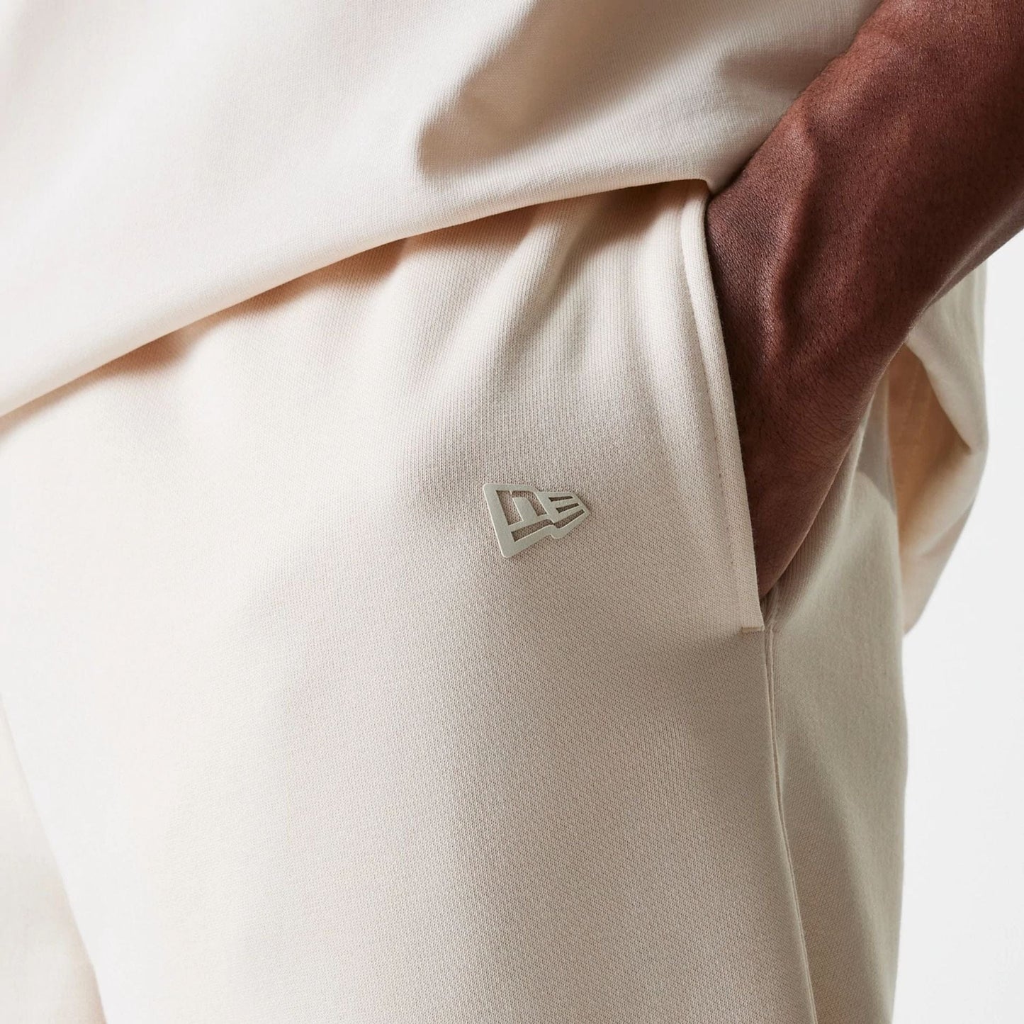 The Male model is wearing New Era Light Beige Straight Leg Joggers 6