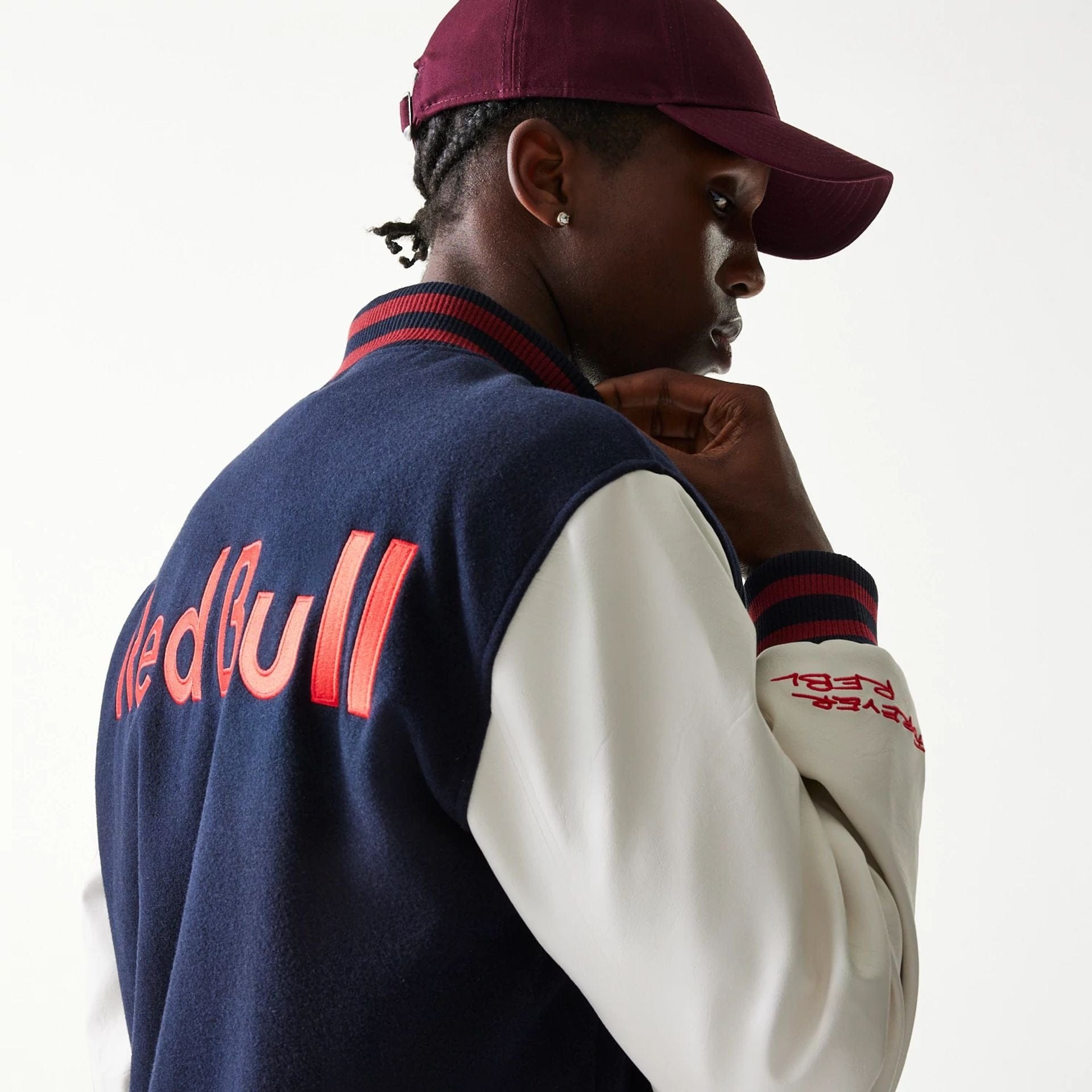 The Male model is wearing Red Bull Racing Dark Blue Varsity Jacket 6