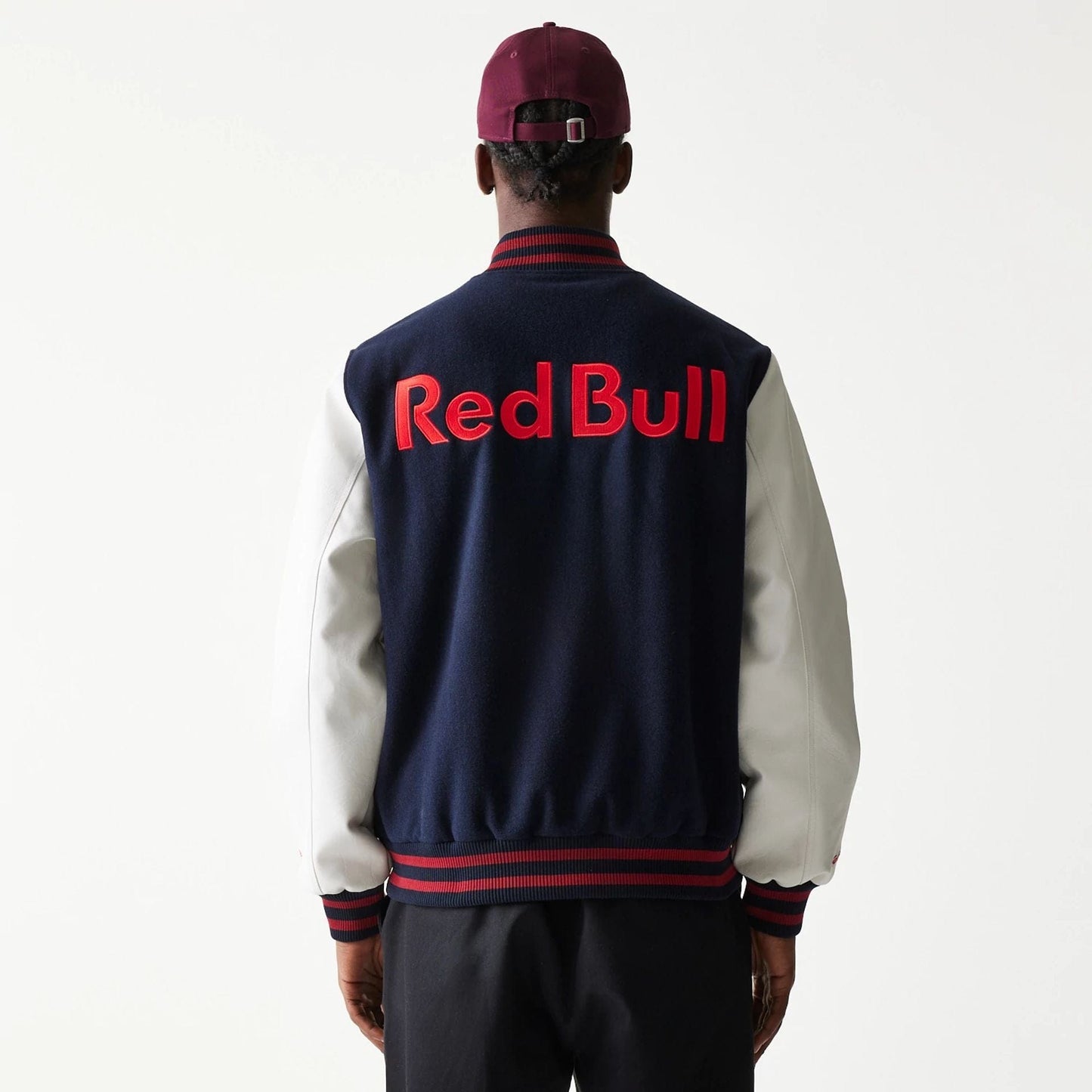 The Male model is wearing Red Bull Racing Dark Blue Varsity Jacket 2