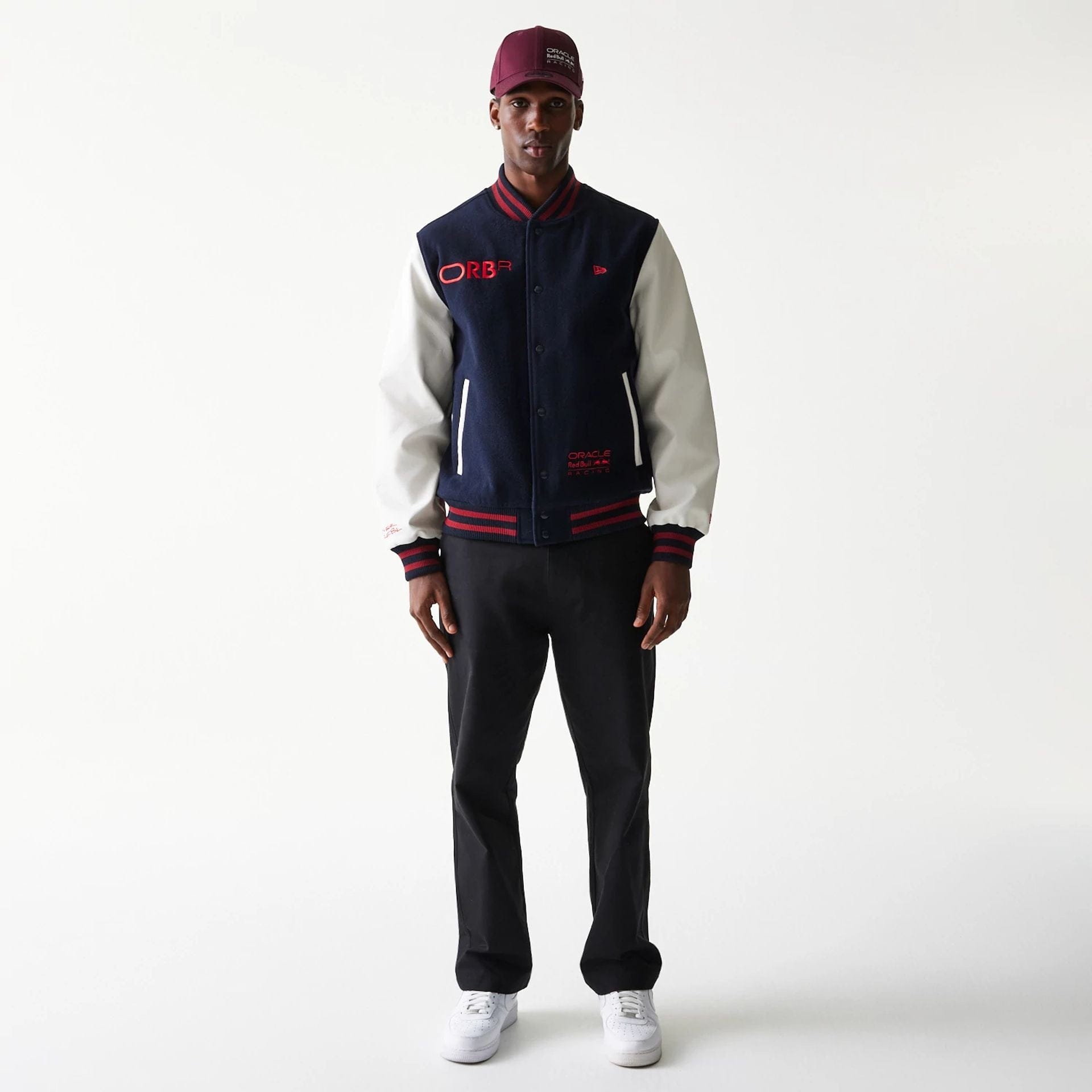 The Male model is wearing Red Bull Racing Dark Blue Varsity Jacket 7