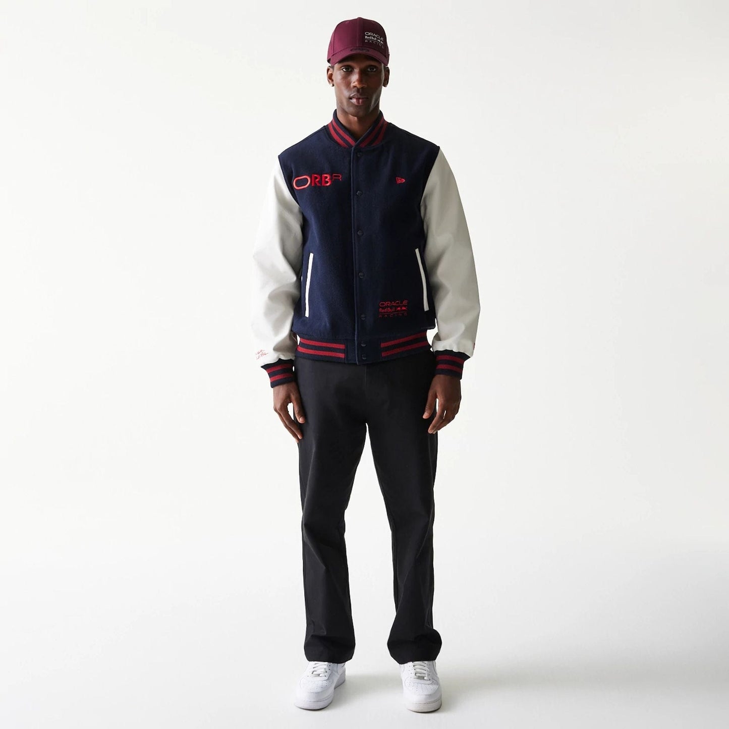 The Male model is wearing Red Bull Racing Dark Blue Varsity Jacket 7