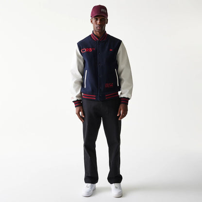 The Male model is wearing Red Bull Racing Dark Blue Varsity Jacket 7