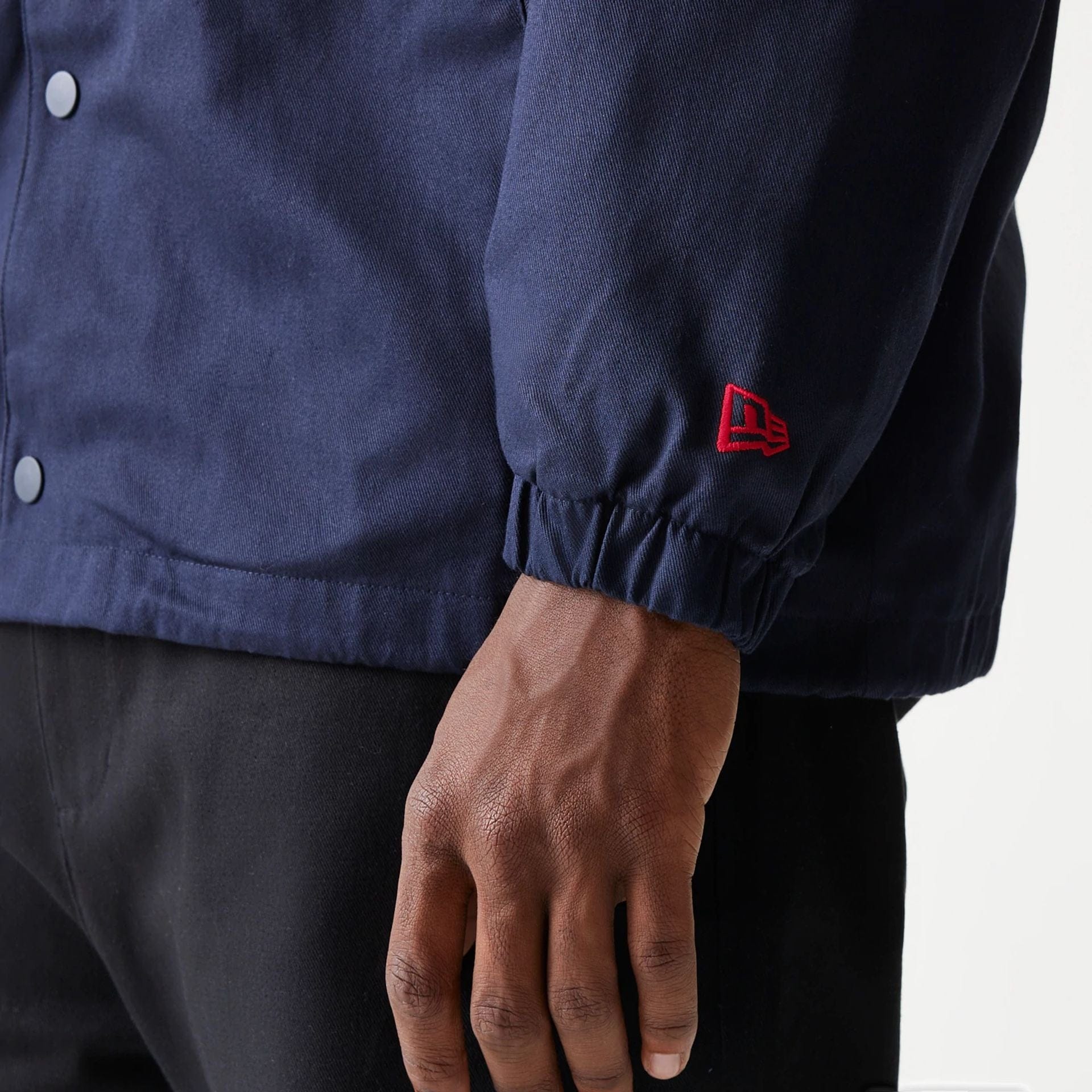 The Male model is wearing Red Bull Racing Dark Blue Oversized Coach Jacket 7