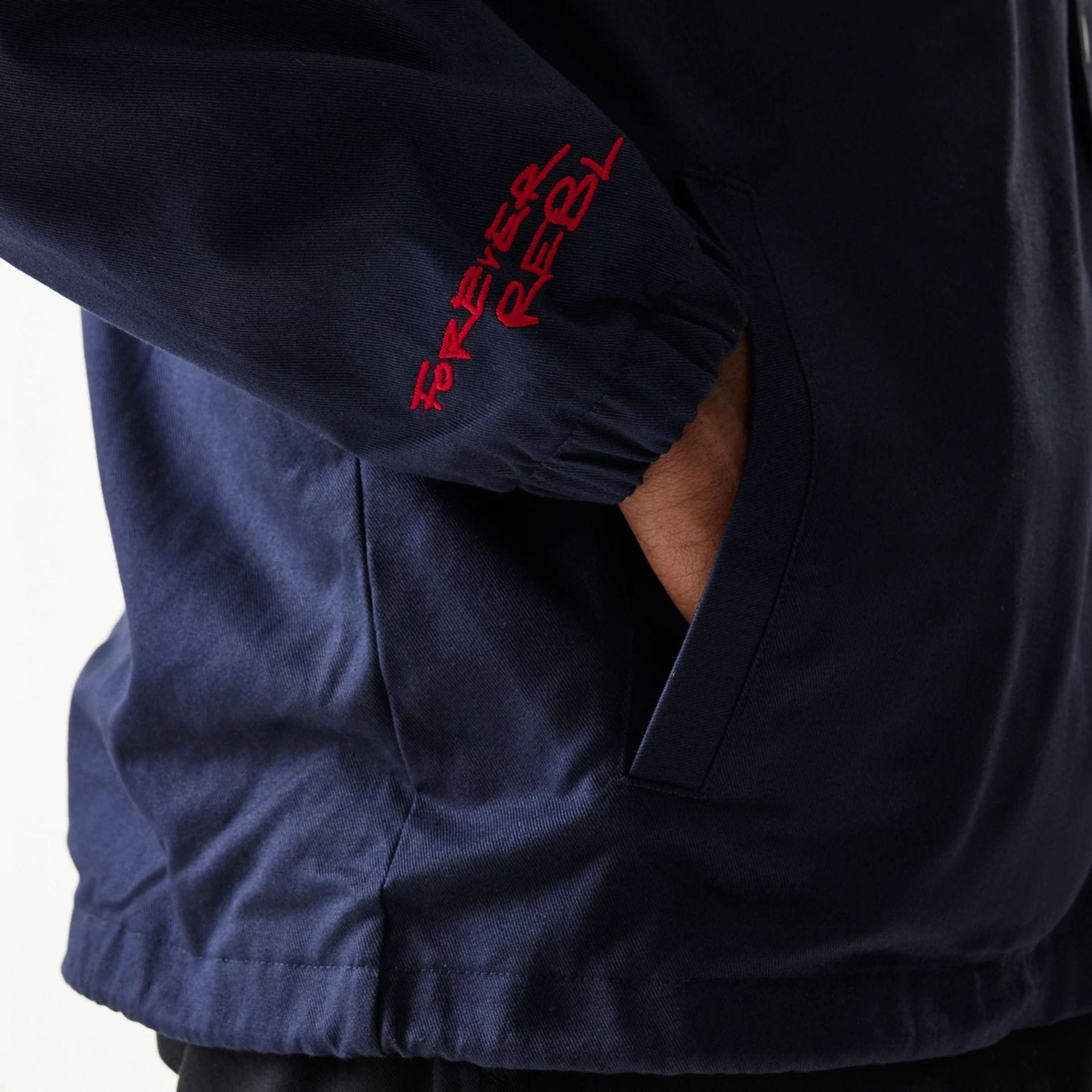 The Male model is wearing Red Bull Racing Dark Blue Oversized Coach Jacket 4
