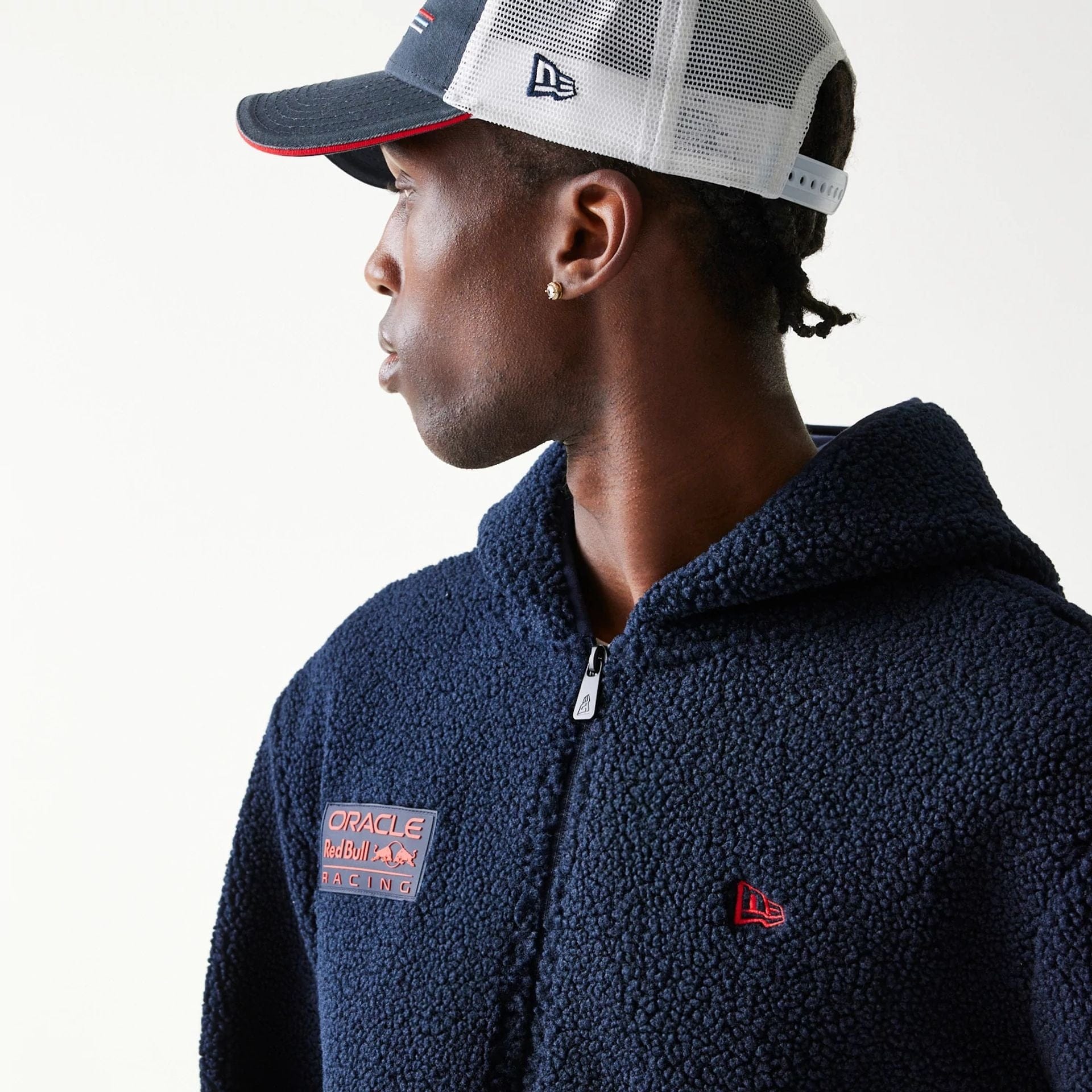The Male model is wearing Red Bull Racing Dark Blue Hooded Sherpa Jacket 3