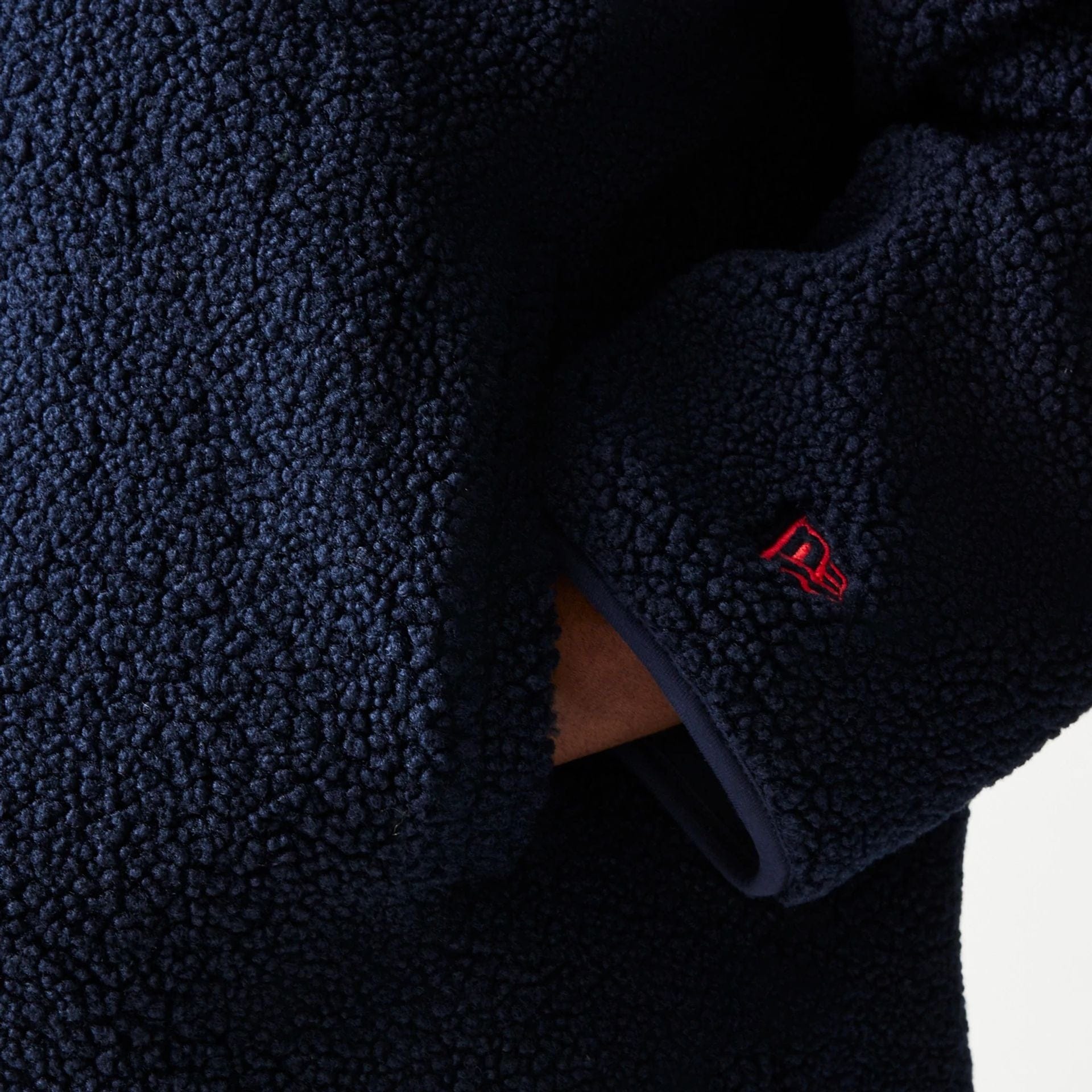 The Male model is wearing Red Bull Racing Dark Blue Hooded Sherpa Jacket 4