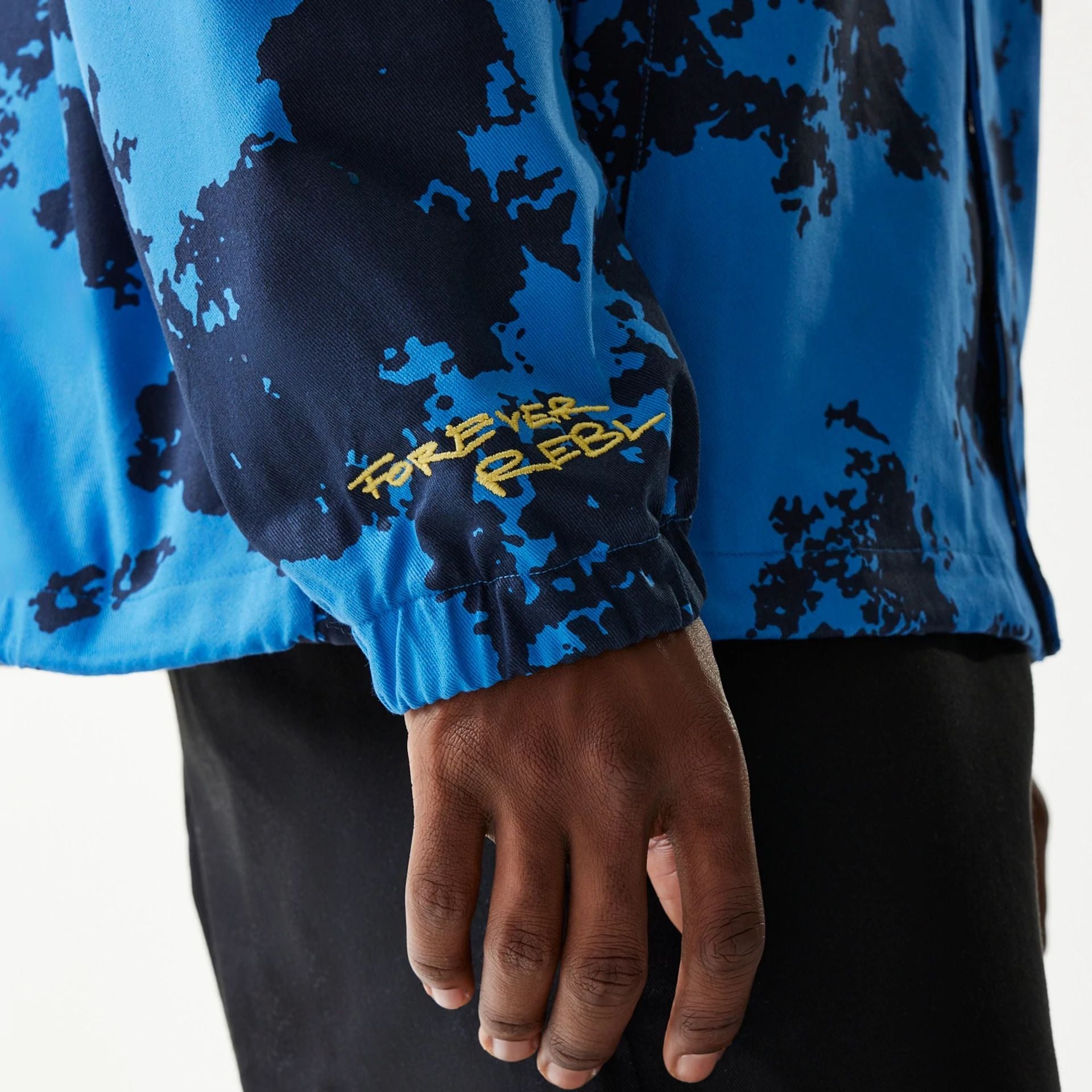 The Male model is wearing Red Bull Racing Blue Oversized Coaches Jacket 6