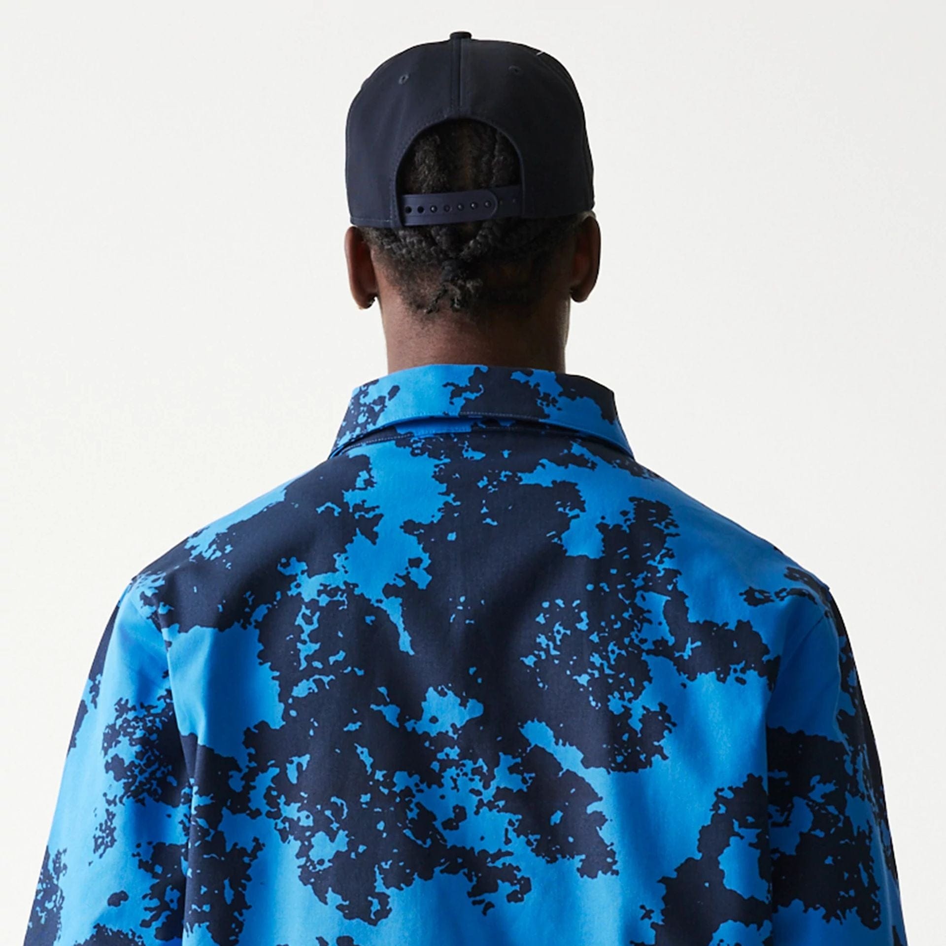 The Male model is wearing Red Bull Racing Blue Oversized Coaches Jacket 7