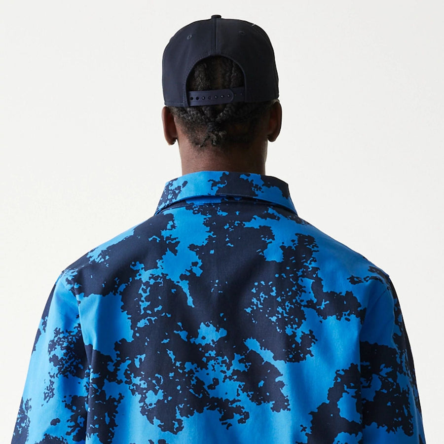 The Male model is wearing Red Bull Racing Blue Oversized Coaches Jacket 7