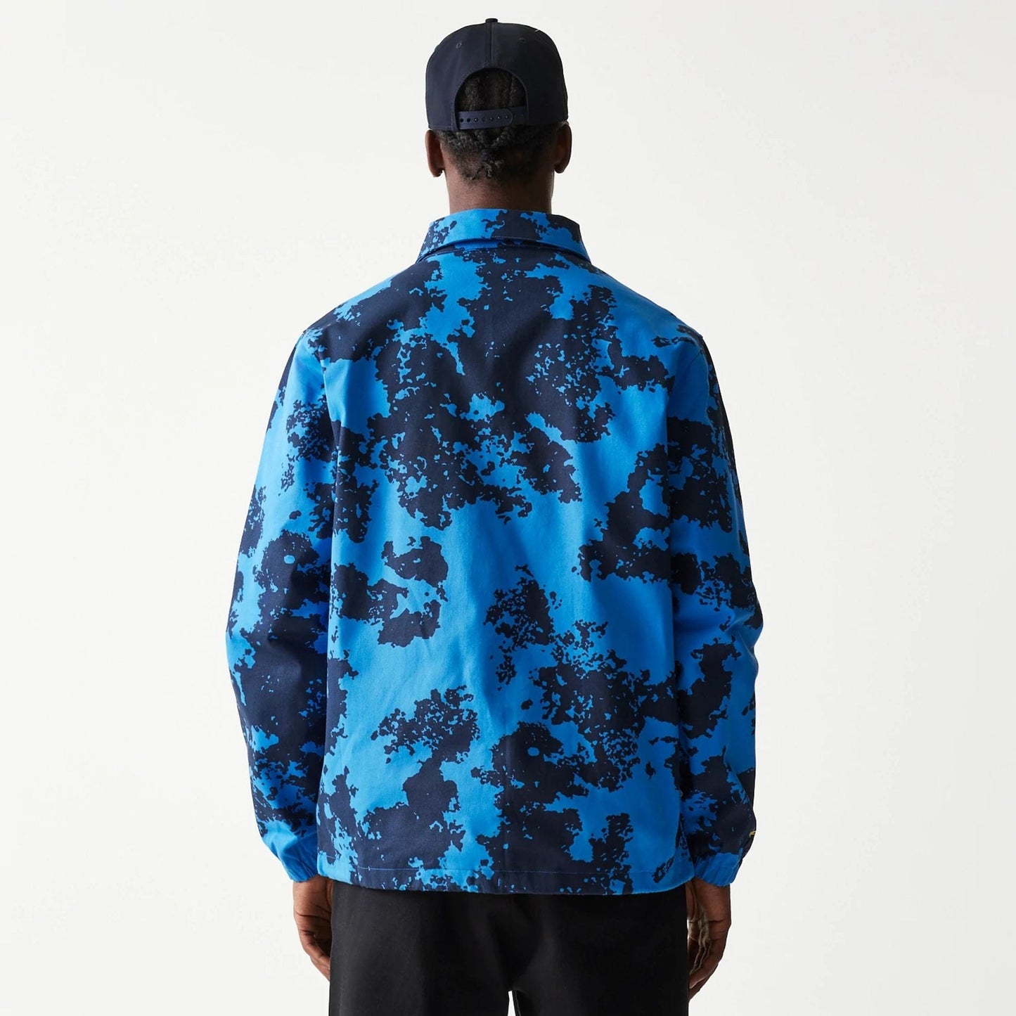 The Male model is wearing Red Bull Racing Blue Oversized Coaches Jacket 2