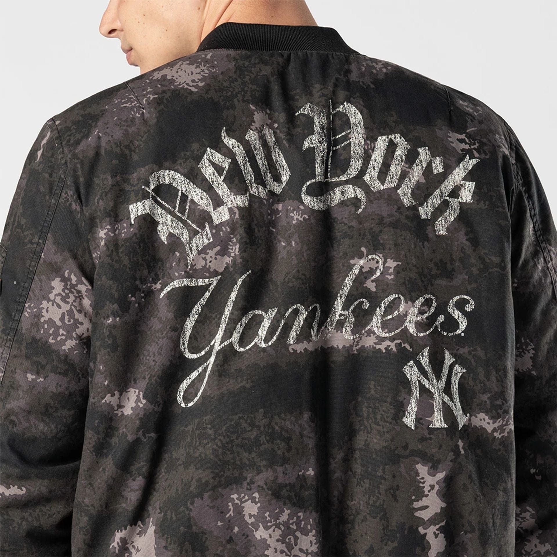 The Male model is wearing New York Yankees MLB X Alpha Black Bomber Jacket 4