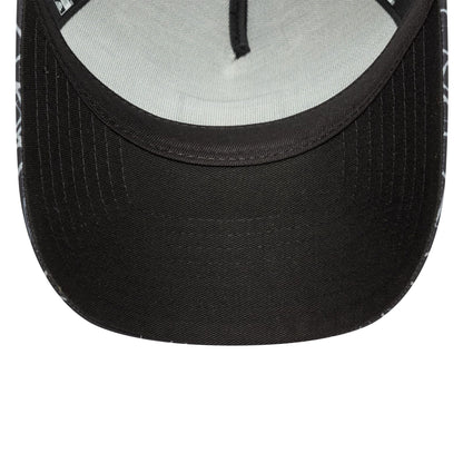 This is a Manchester United FC All Over Print Black 9FORTY E-Frame Trucker Adjustable Cap 5