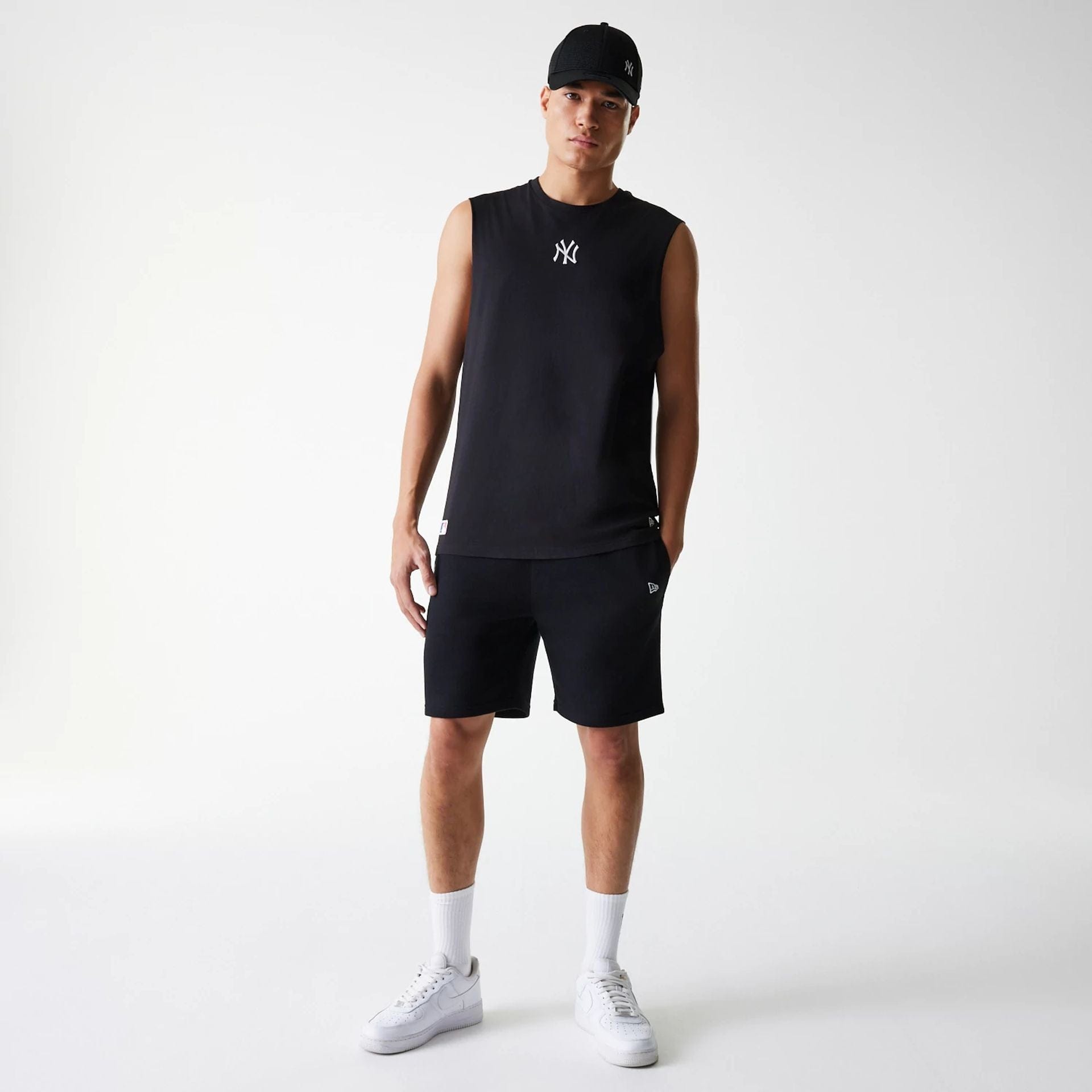 The Male model is wearing New York Yankees MLB Midi Black Sleeveless T-Shirt 6
