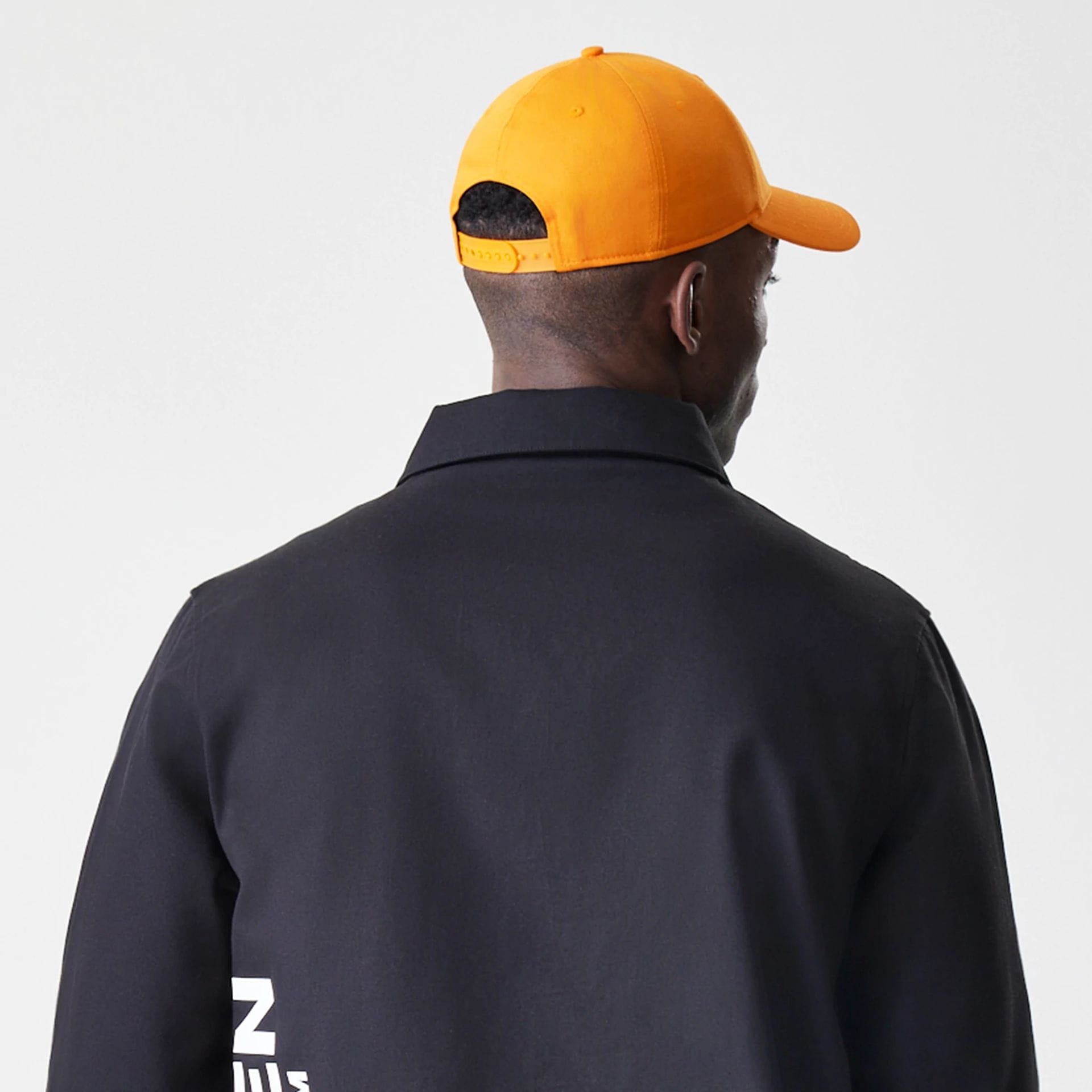 The Male model is wearing McLaren Racing McLaren Black Coaches Jacket 7