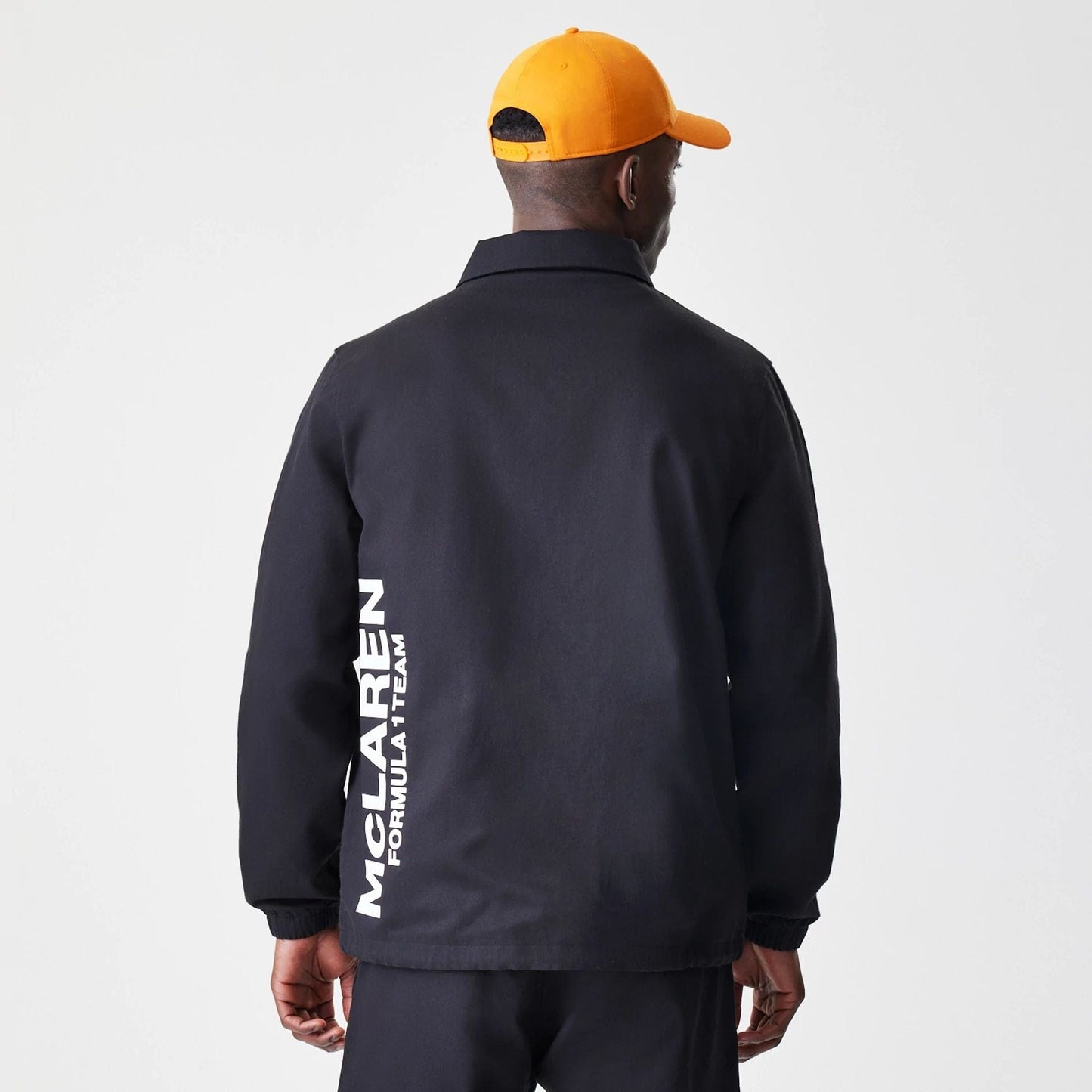 The Male model is wearing McLaren Racing McLaren Black Coaches Jacket 2