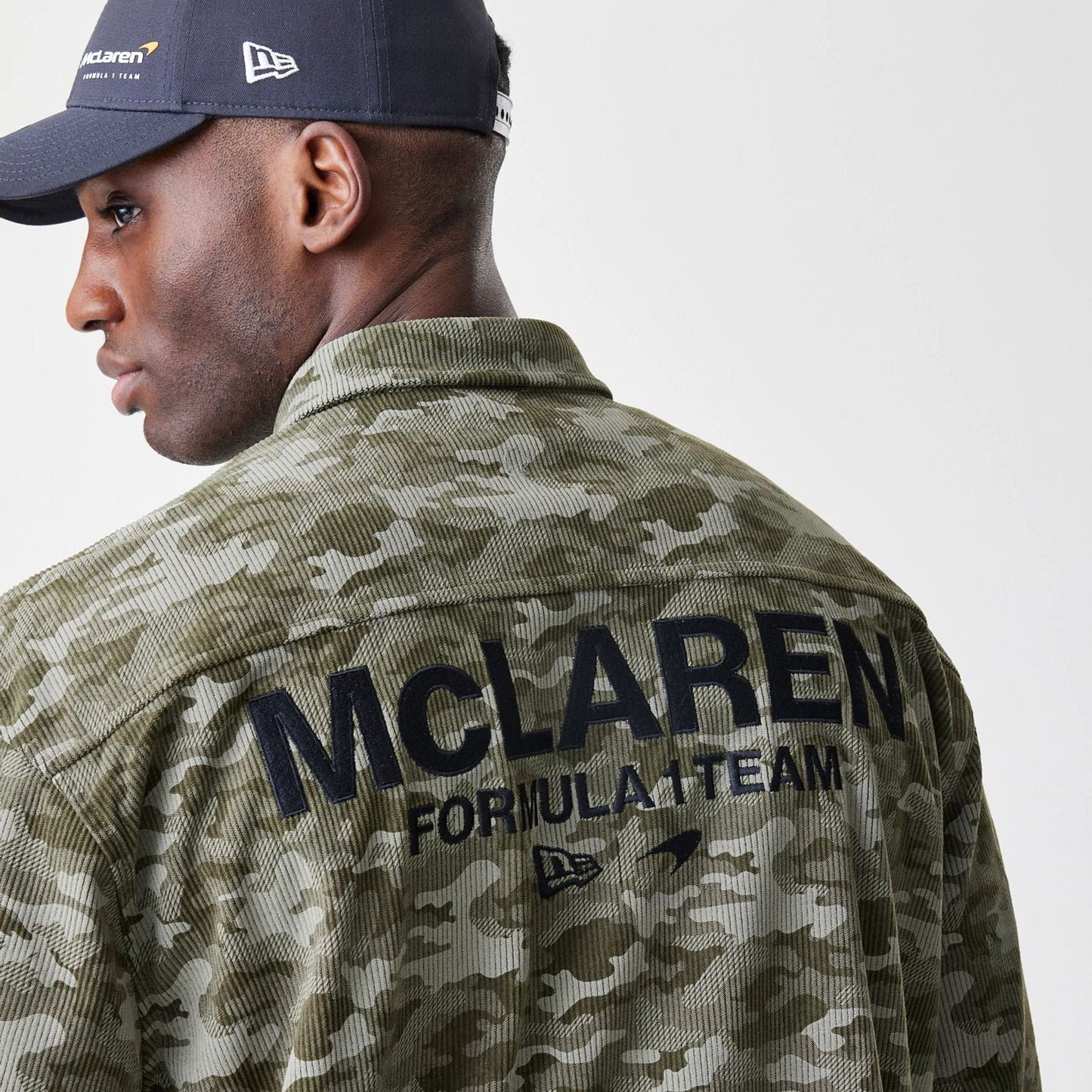 The Male model is wearing McLaren Racing Graphic Green Long Sleeve Shirt  4