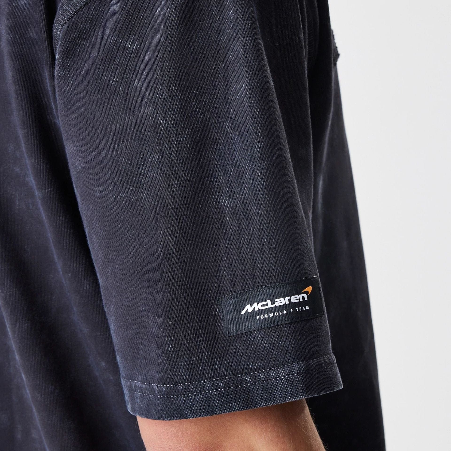 The Male model is wearing McLaren Racing Washed Black Oversized T-Shirt  6