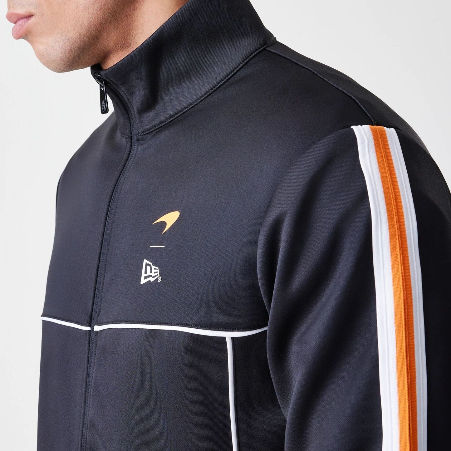 The Male model is wearing McLaren Racing Poly Black Track Jacket  4