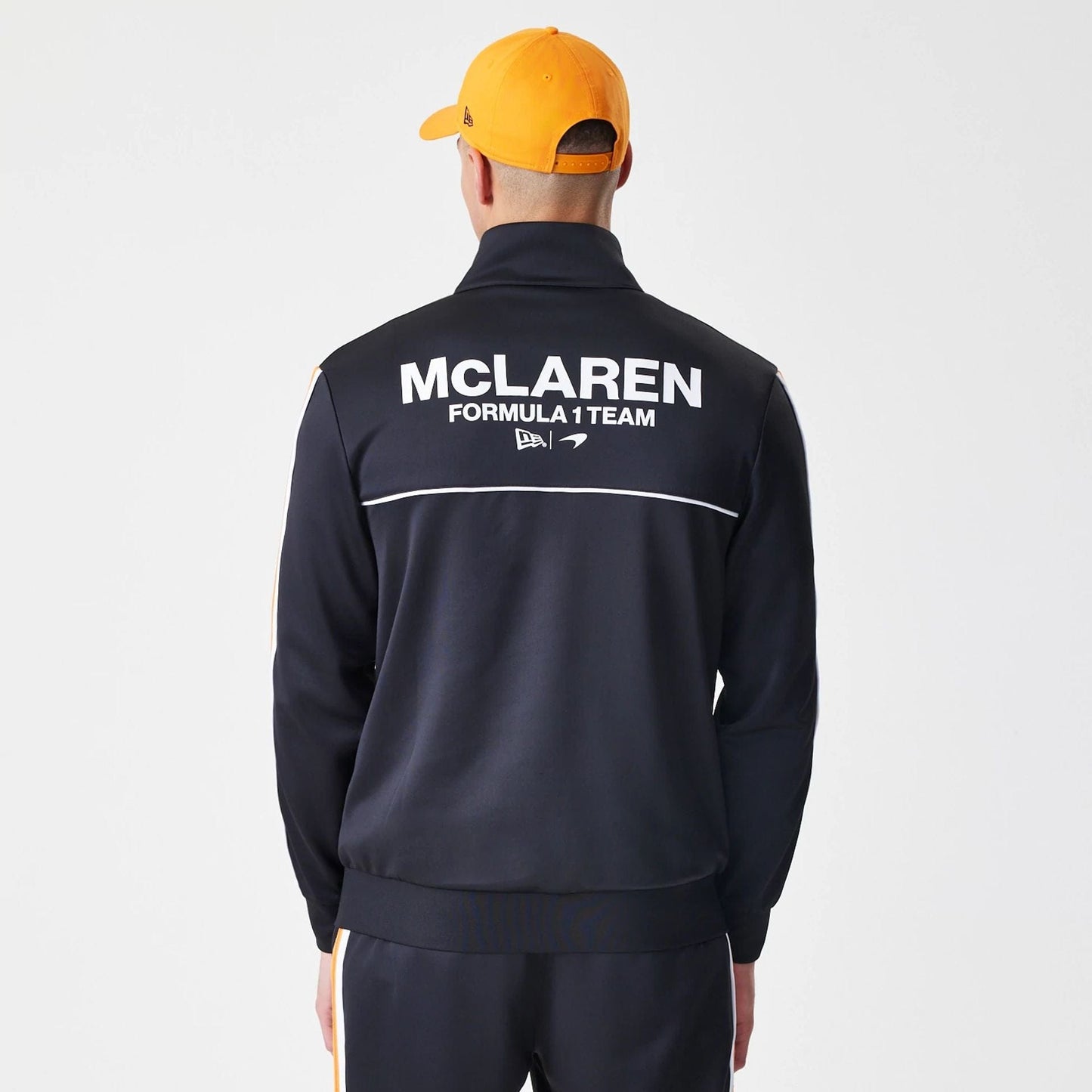 The Male model is wearing McLaren Racing Poly Black Track Jacket  2