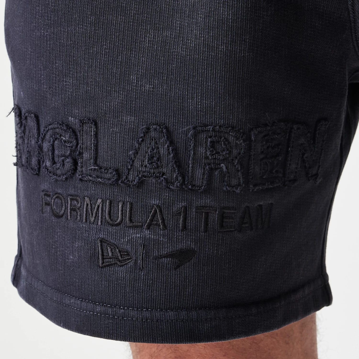 The Male model is wearing McLaren Racing Washed Black Shorts 4