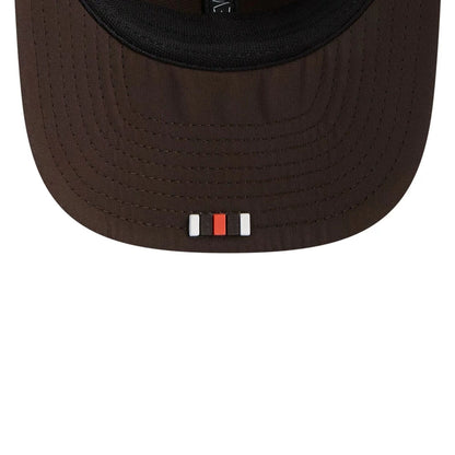 This is a Cleveland Browns NFL Sideline 2025 Dark Brown 9SEVENTY Trucker Stretch Snap Adjustable Cap 7