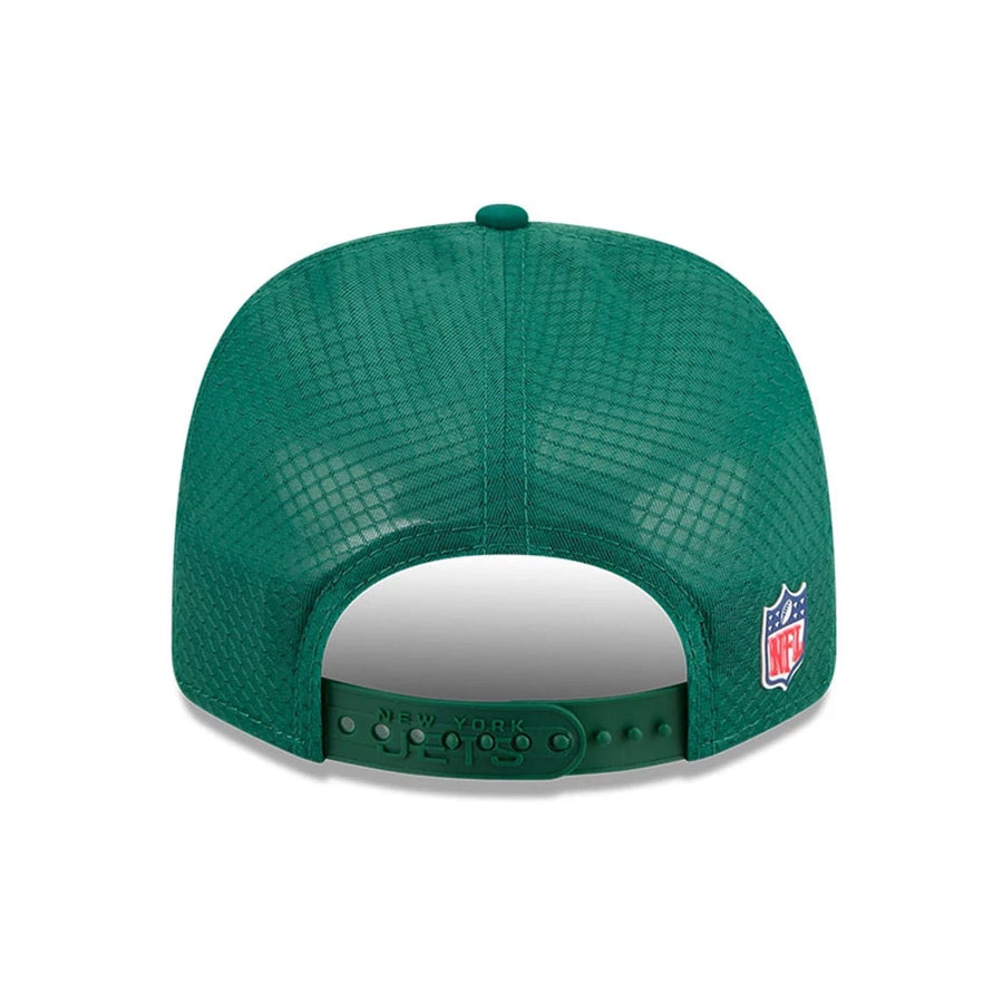 This is a New York Jets NFL Sideline 2025 Green 9SEVENTY Trucker Stretch Snap Adjustable Cap 7