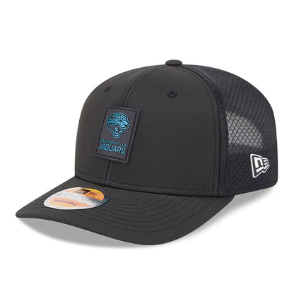 This is a Jacksonville Jaguars NFL Sideline 2025 Black 9SEVENTY Trucker Stretch Snap Adjustable Cap 1