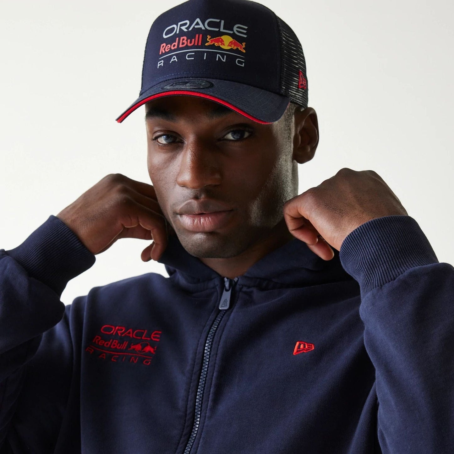 The Male model is wearing Red Bull Racing Dark Blue Oversized Full Zip Hoodie 3