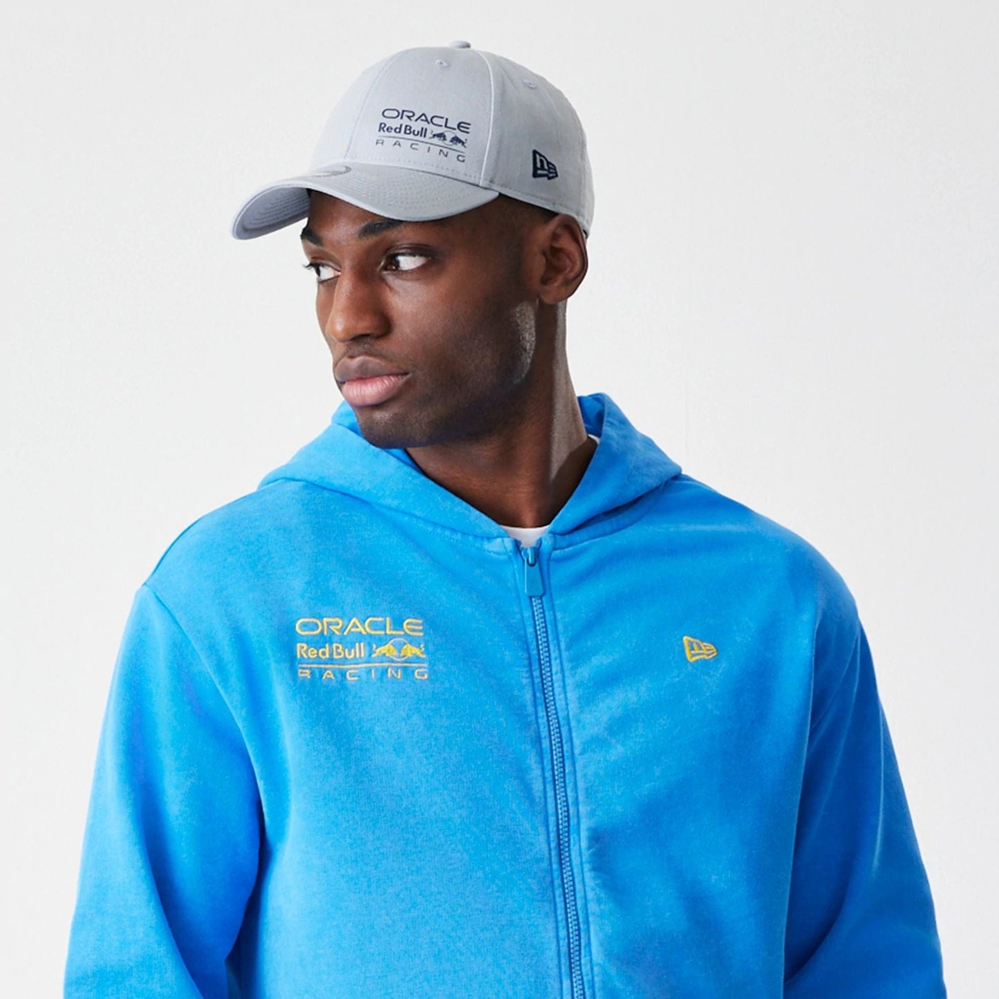 The Male model is wearing Red Bull Racing Blue Oversized Full Zip Hoodie 6