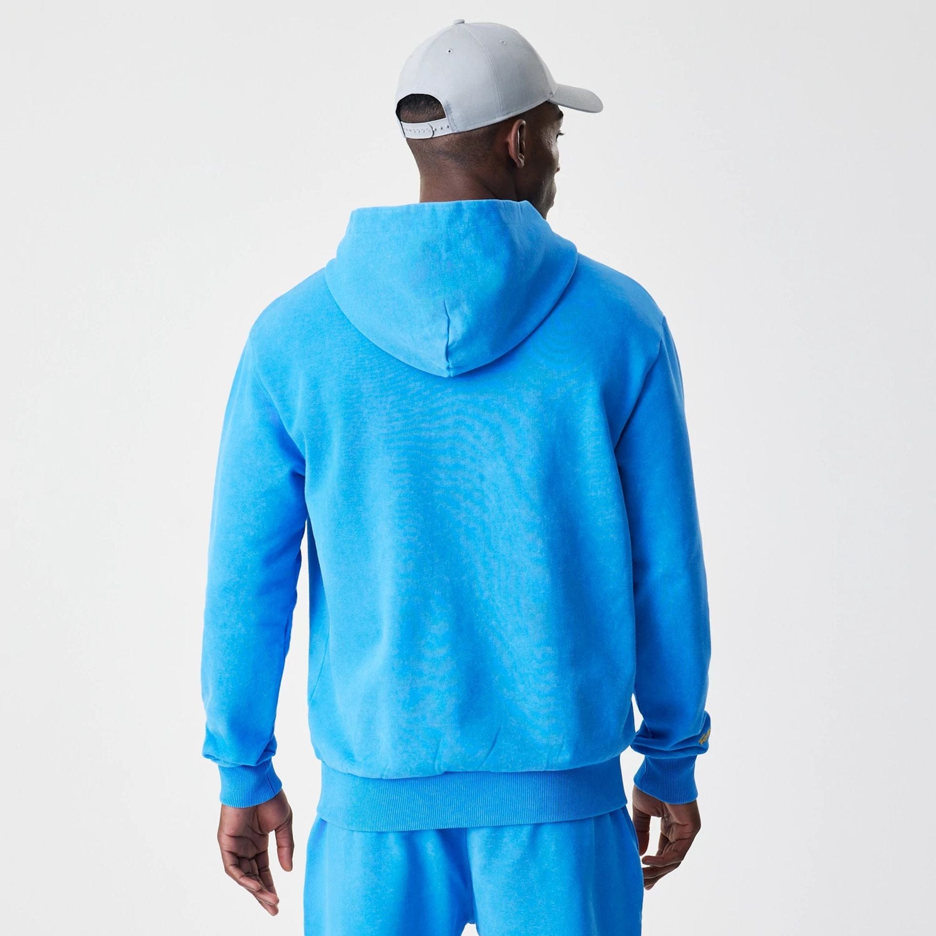 The Male model is wearing Red Bull Racing Blue Oversized Full Zip Hoodie 2