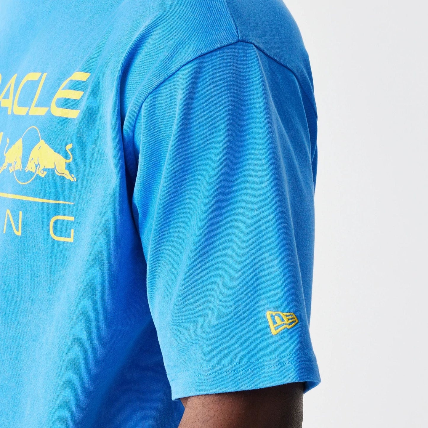 The Male model is wearing Red Bull Racing Blue Oversized T-Shirt 4