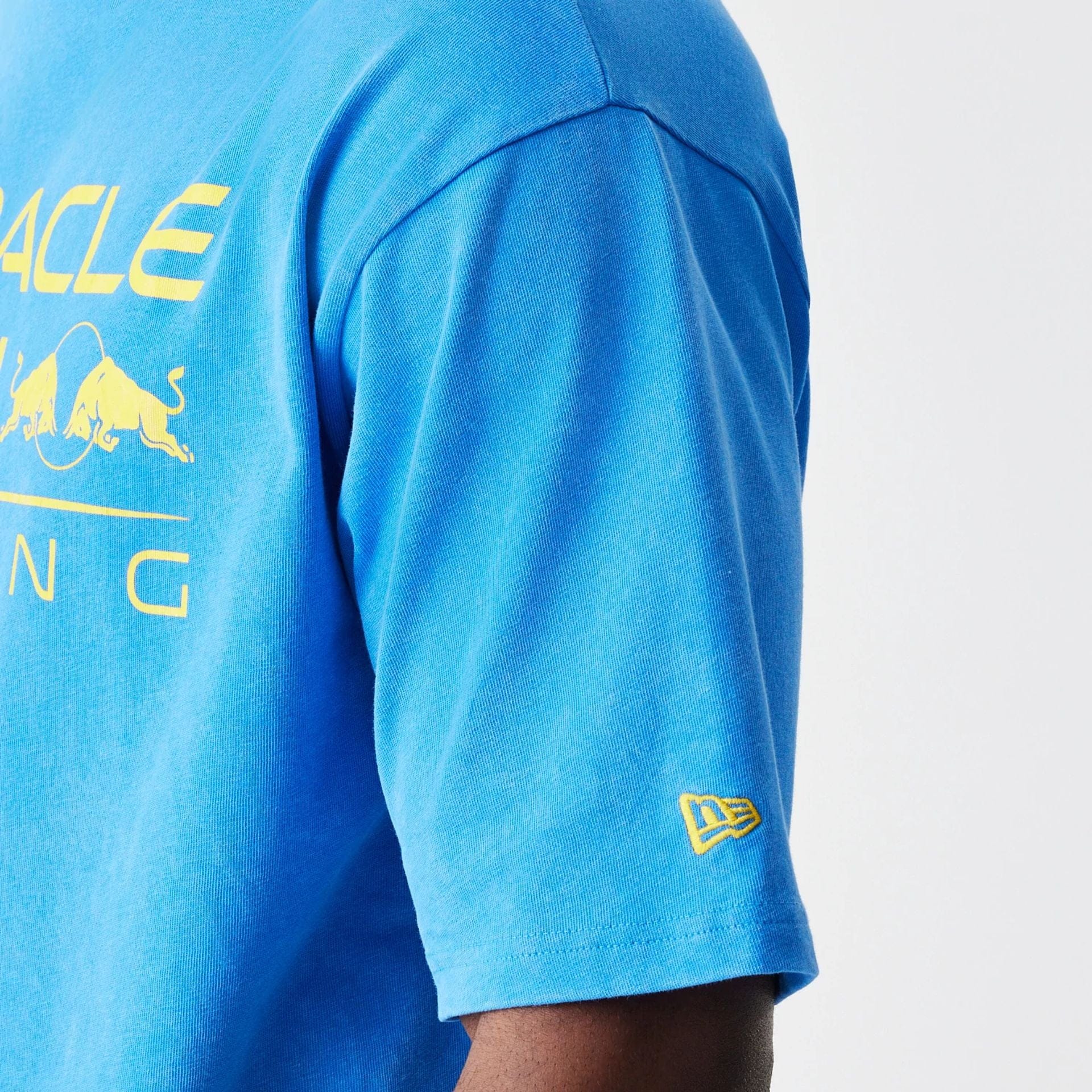 The Male model is wearing Red Bull Racing Blue Oversized T-Shirt 4