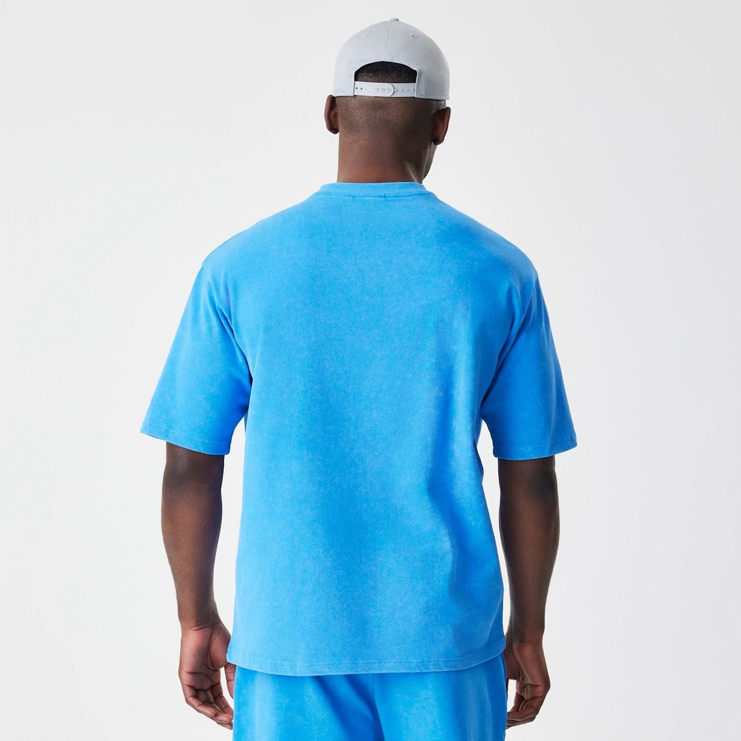 The Male model is wearing Red Bull Racing Blue Oversized T-Shirt 2