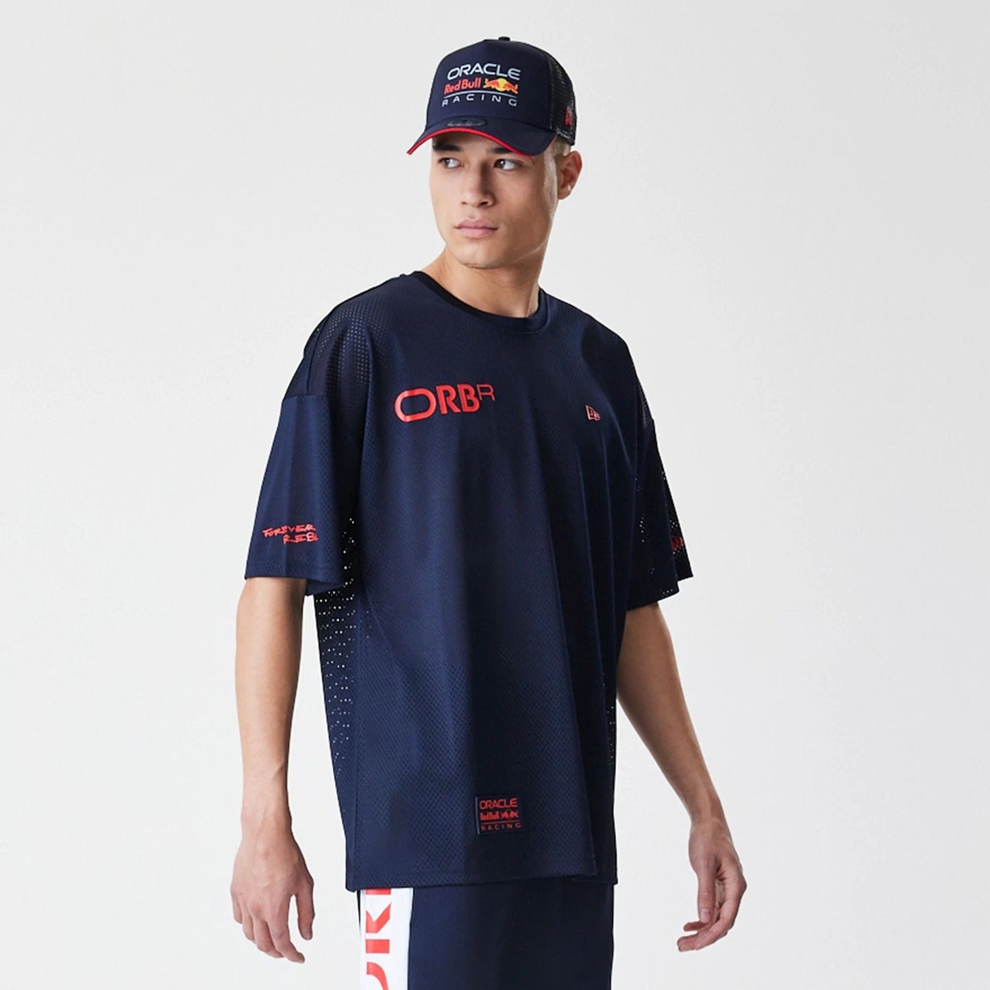 The Male model is wearing Red Bull Racing Graphic Mesh Dark Blue Shorts 7