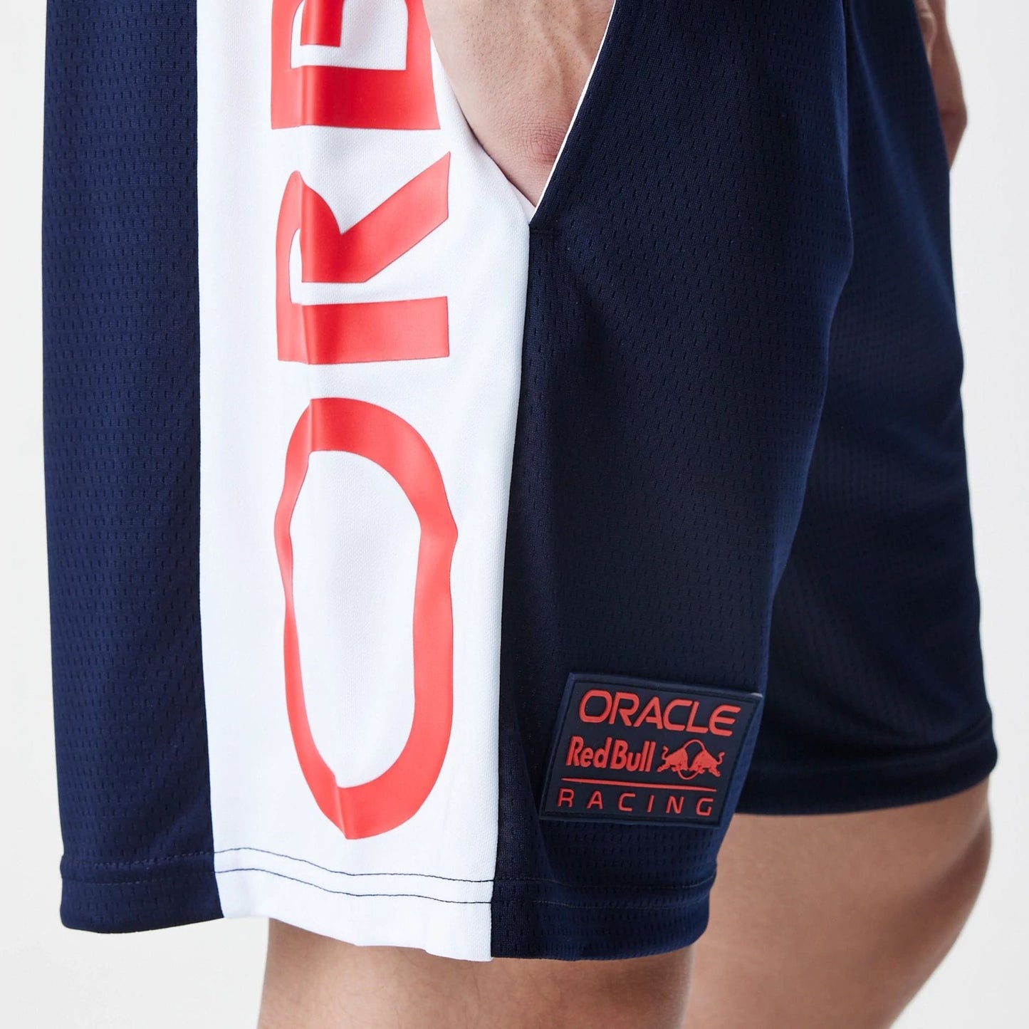 The Male model is wearing Red Bull Racing Graphic Mesh Dark Blue Shorts 3