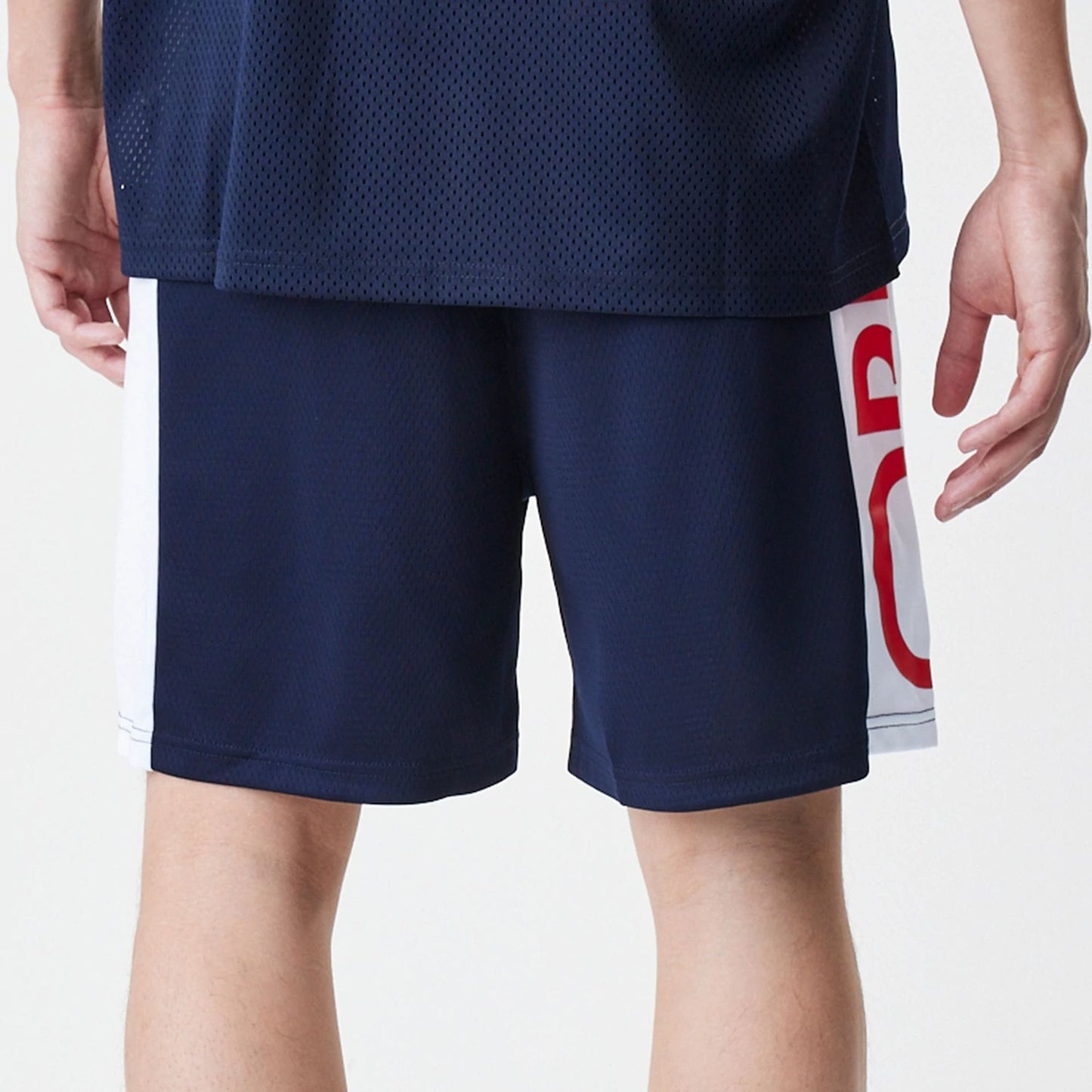 The Male model is wearing Red Bull Racing Graphic Mesh Dark Blue Shorts 5