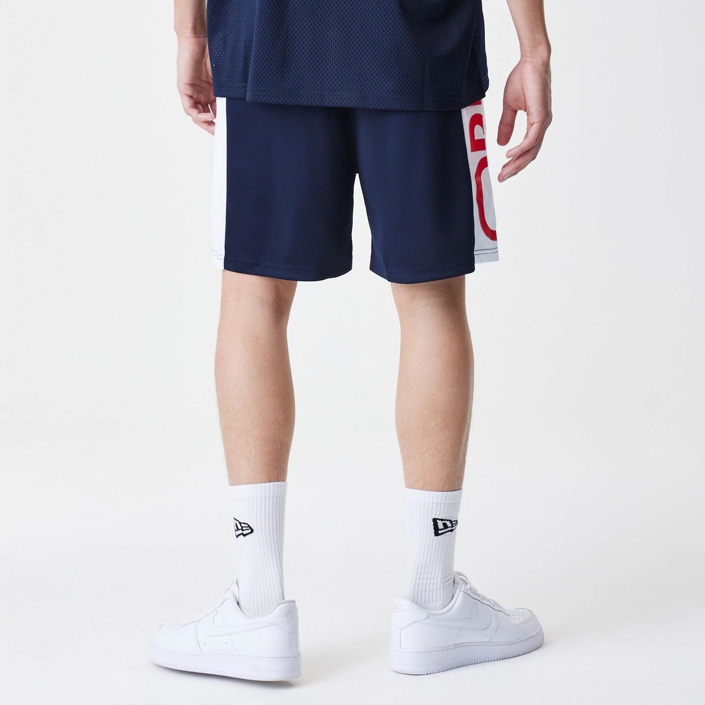 The Male model is wearing Red Bull Racing Graphic Mesh Dark Blue Shorts 2