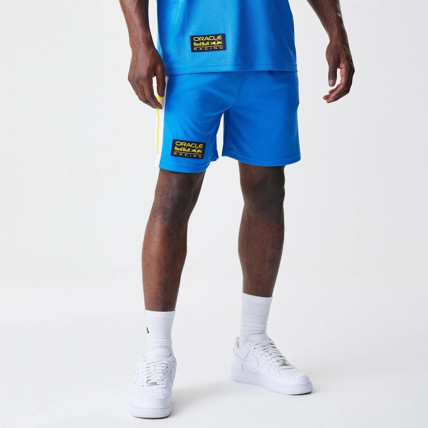 The Male model is wearing Red Bull Racing Graphic Mesh Blue Shorts 1