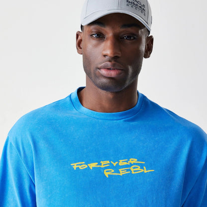 The Male model is wearing Red Bull Racing Back Graphic Blue Oversized T-Shirt 5