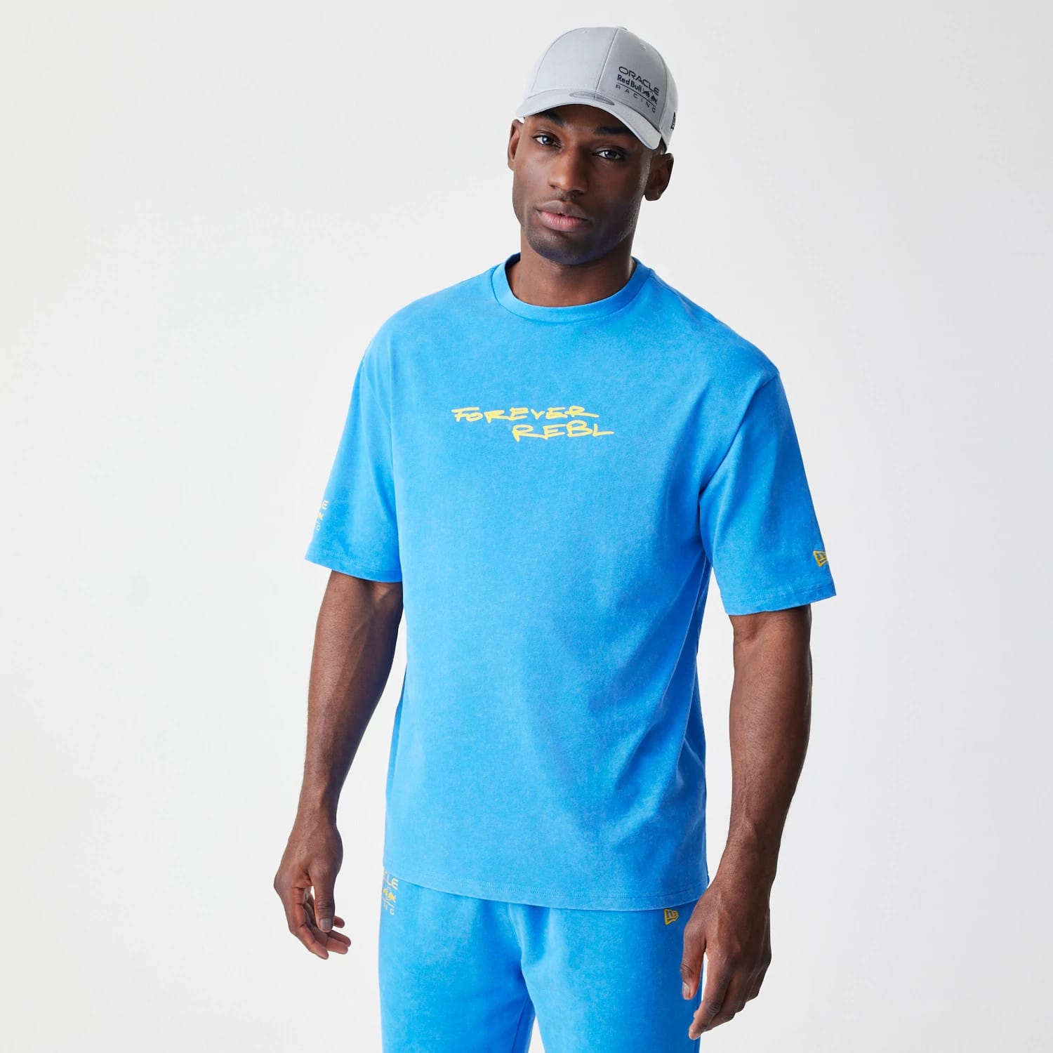 The Male model is wearing Red Bull Racing Back Graphic Blue Oversized T-Shirt 1
